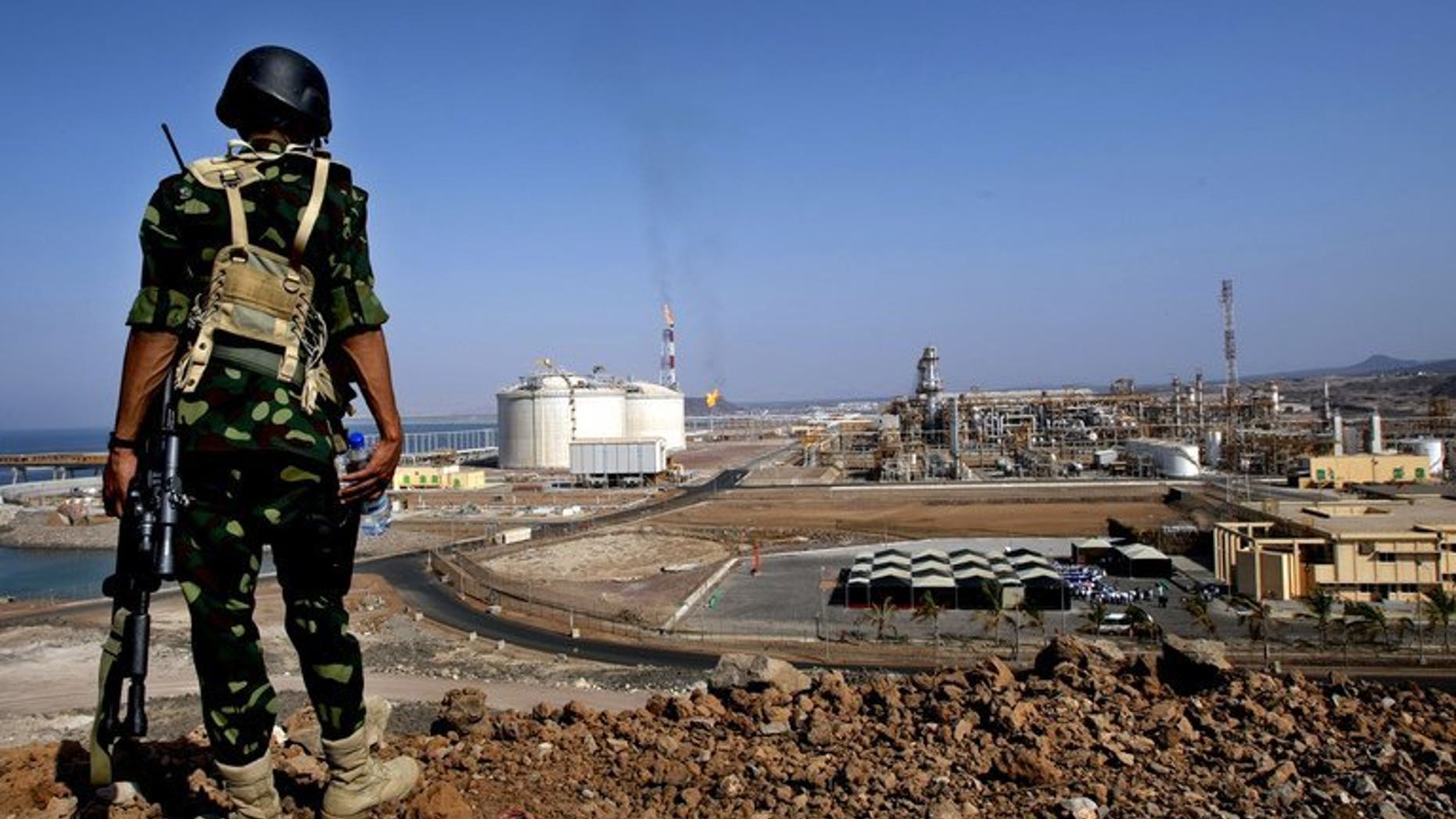 A Yemeni soldier stands guard near a gas plant in Balhaf, on November 7, 2009. Yemeni authorities have sent more soldiers to the coastal town of Balhaf, a day after an alleged Al-Qaeda plot to attack a key gas terminal was foiled, a security official tells AFP.