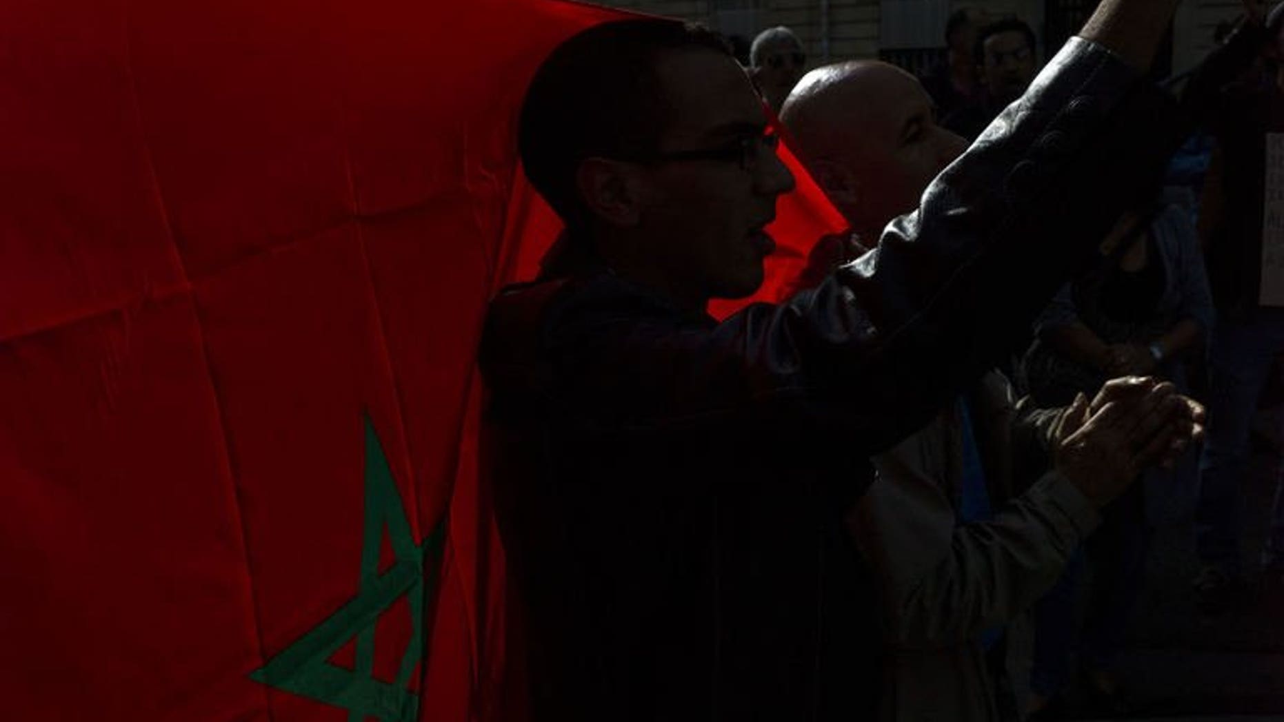 Dozens of people protest in front of Morocco ambassy, on September 21, 2013 in Paris, to call for the release of Ali Anouzla, a news website editor arrested on September 17 in Rabat after he posted an article about a jihadist video.