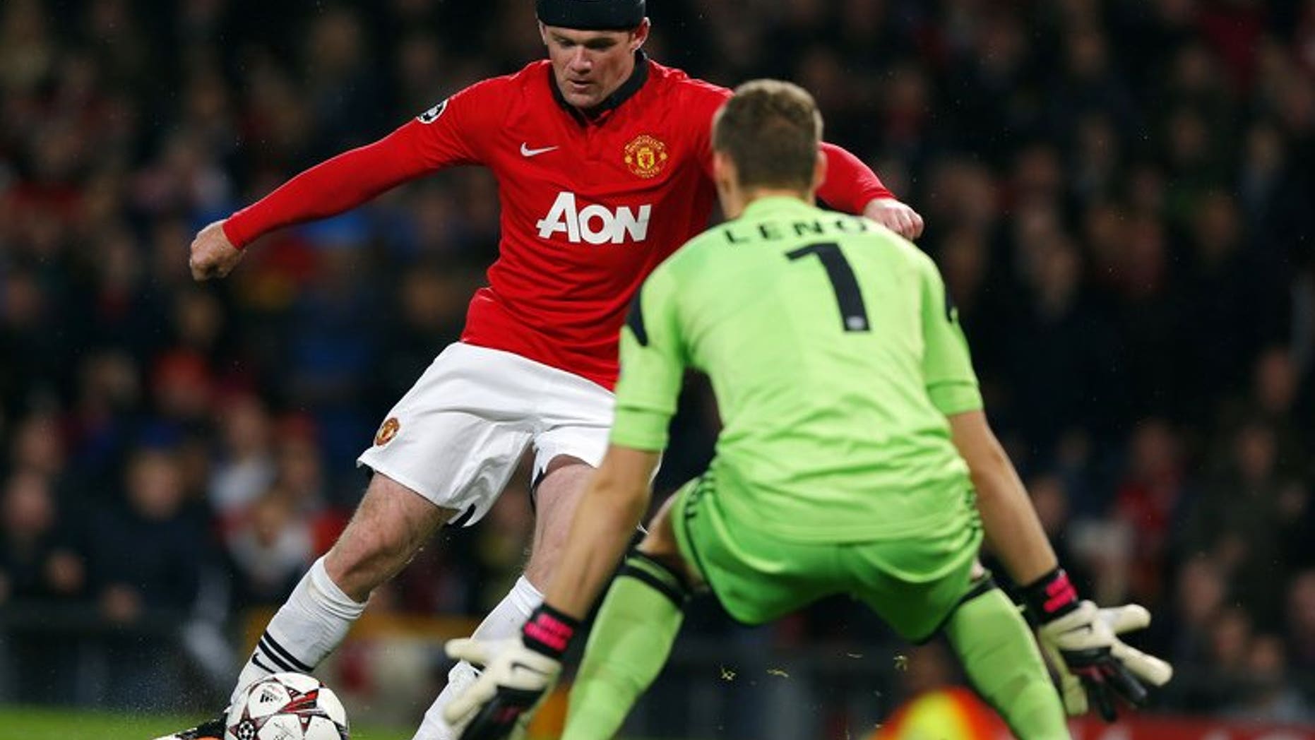 Manchester United's Wayne Rooney (left) and Bayer Leverkusen's Bernd Leno at Old Trafford, September 17, 2013. Rooney was never close to joining Chelsea in the summer because Manchester United would not have sold him, former chief executive David Gill said Sunday.