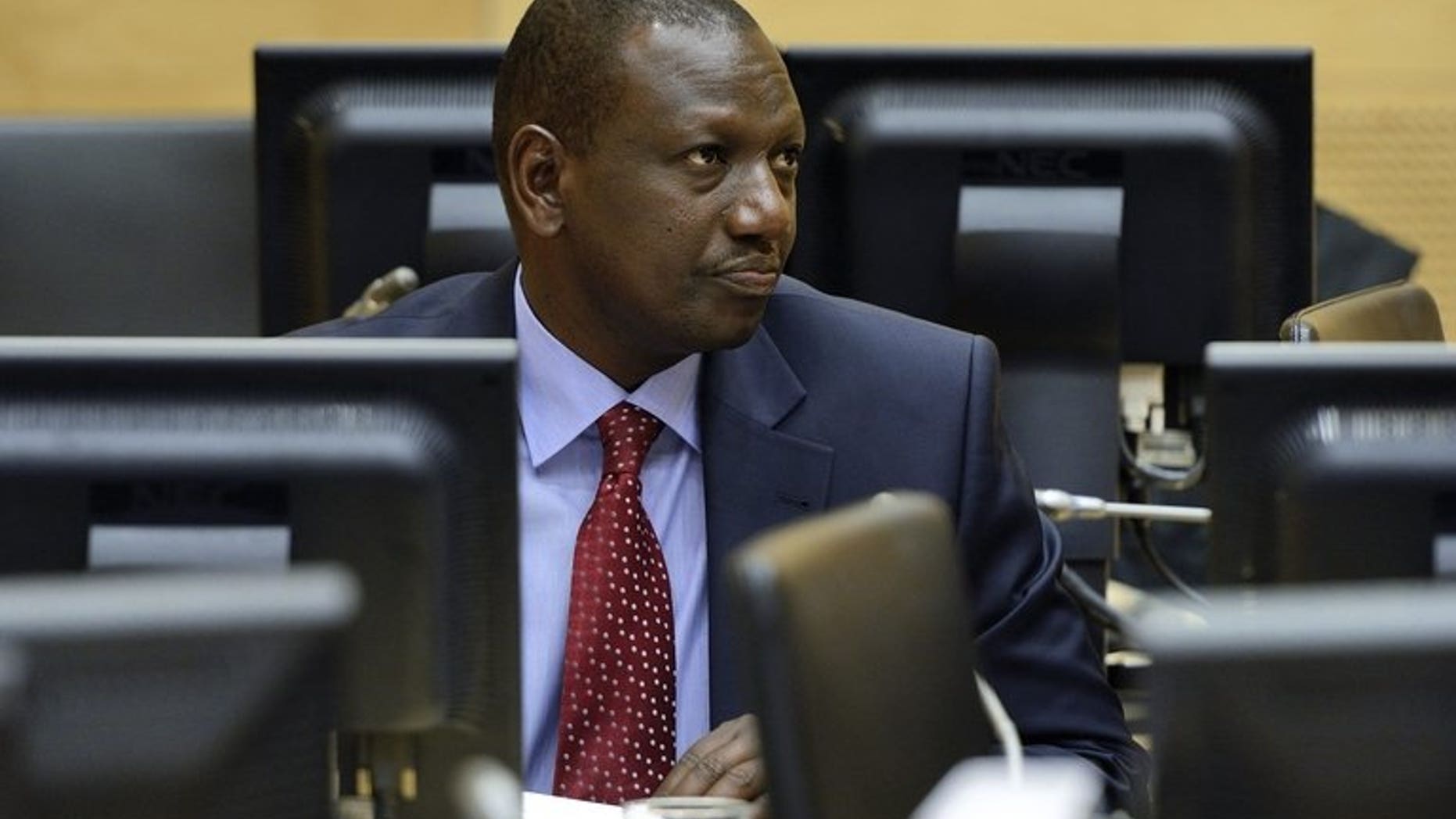 Kenyan vice-President William Samoei Ruto looks on during a trial hearing in the International Criminal Court in the Hague, Netherlands, on May 14, 2013. Ruto asked the ICC on Sunday to adjourn his trial for crimes against humanity because of the deadly militant attack on a Nairobi shopping mall.