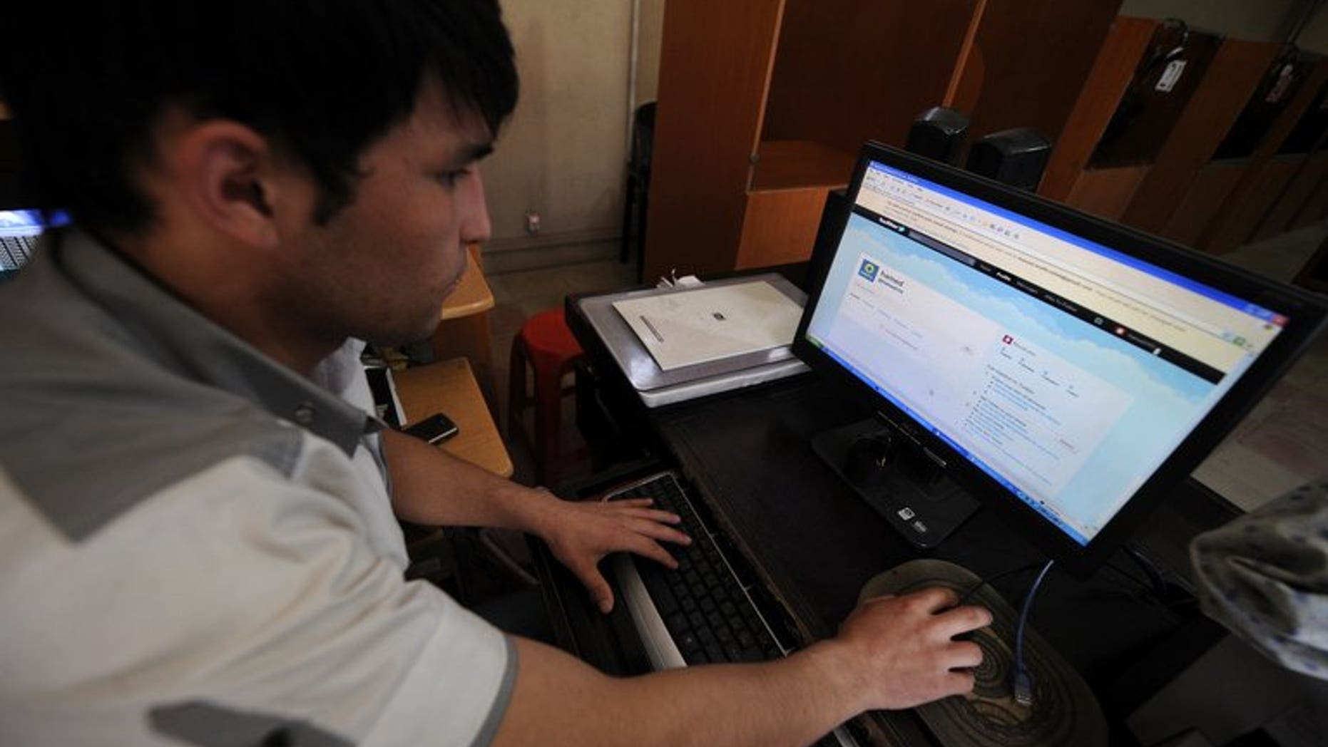 An Afghan uses a computer to access Twitter in Kabul, on May 15, 2011. More than 200 of Afghanistan's most active users of Twitter and Facebook have gathered for the country's first-ever social media summit to explore how the Internet is transforming traditional society.