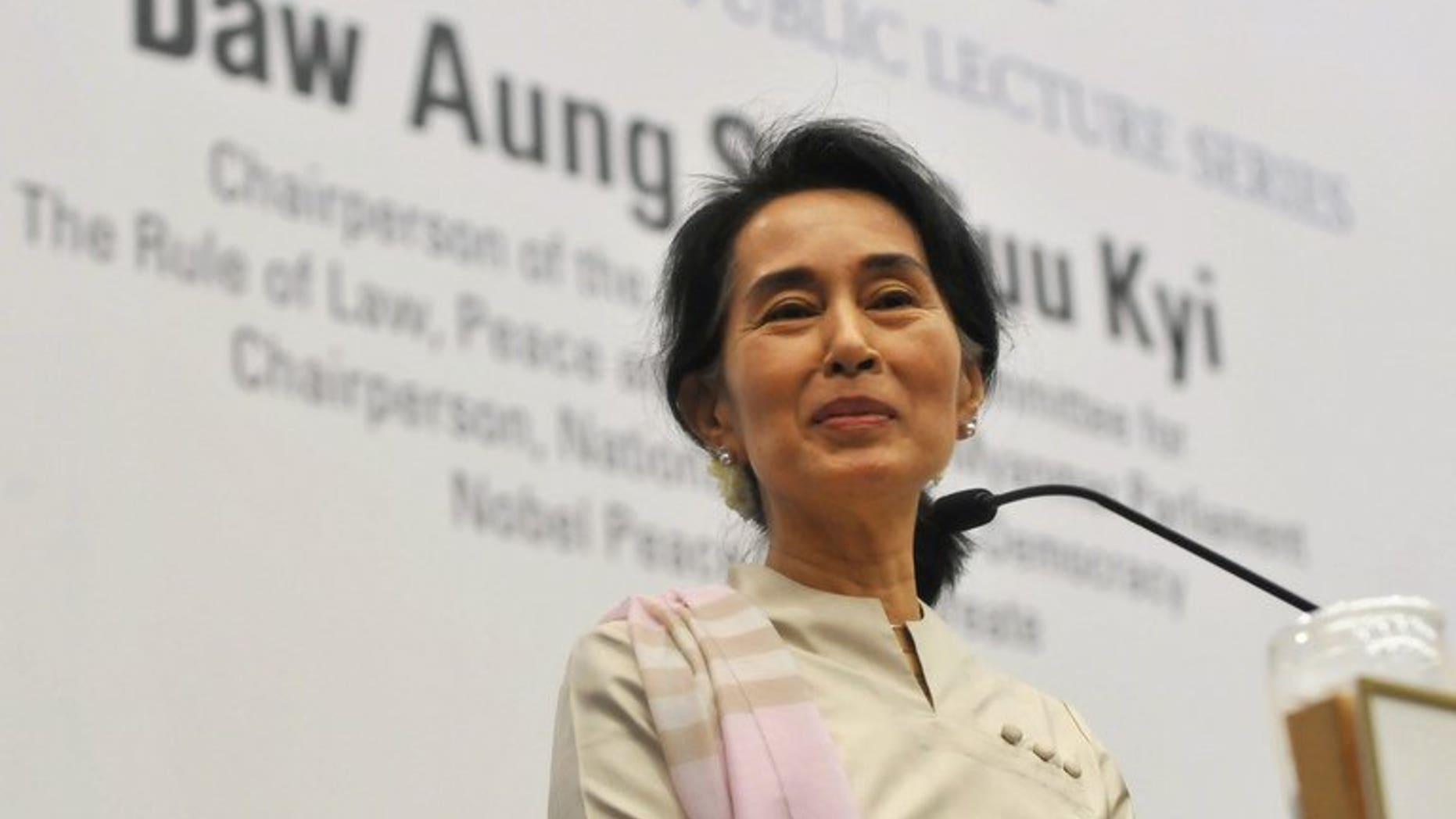 Nobel laureate Aung San Suu Kyi delivers a speech in Singapore, on September 22, 2013. Thousands of Myanmar nationals living in Singapore have given Suu Kyi an emotional welcome as the democracy icon urged them to consider coming home to help rebuild the impoverished nation.