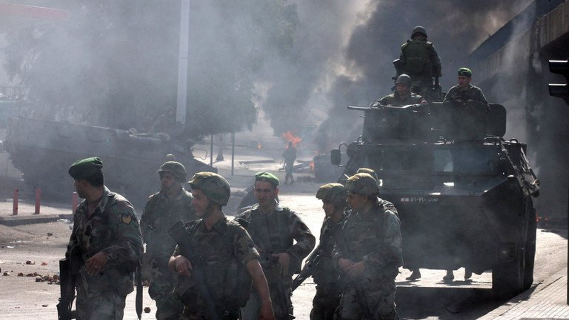Lebanese soldiers patrol the streets of Beirut, on January 25, 2011. Lebanese troops are to take over security at checkpoints set up by the Hezbollah movement in their southern Beirut stronghold after two bombings, the interior minister has told AFP.