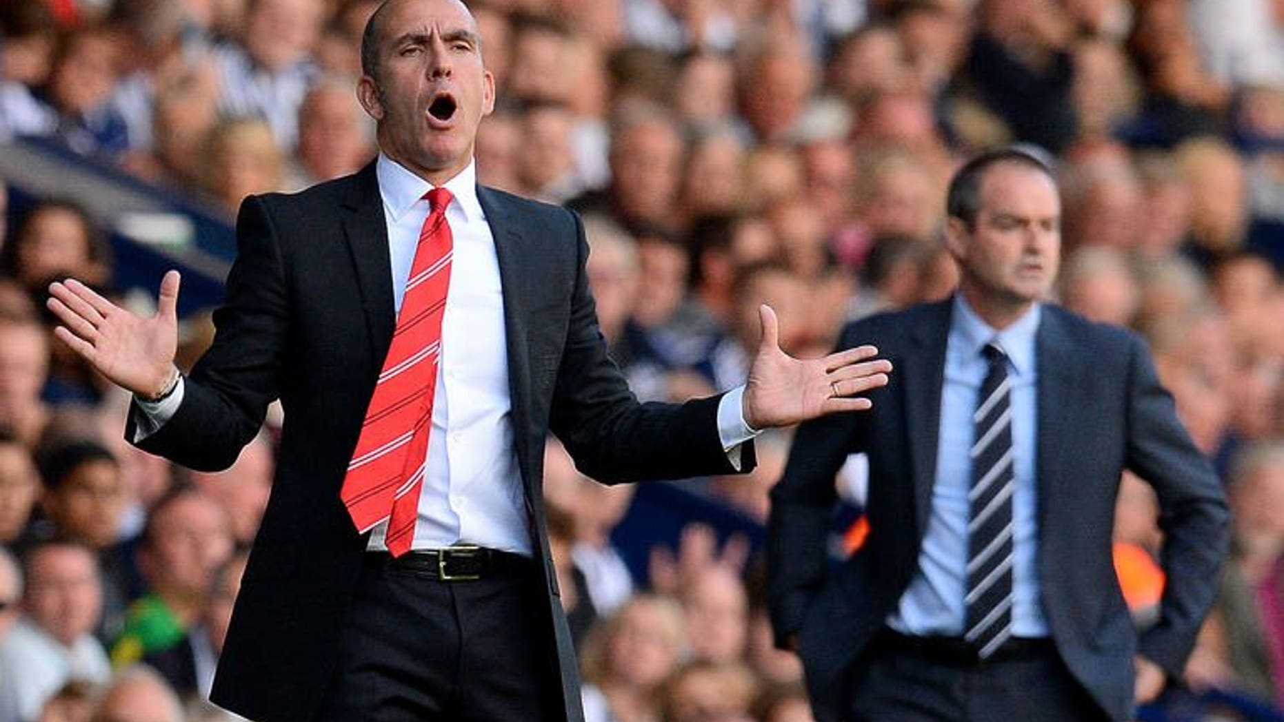 Sunderland manager Paolo Di Canio (L) reacts during the English Premier League football match between West Bromwich Albion and Sunderland at The Hawthorns in West Bromwich, central England, on September 21, 2013. West Bromwich Albion won 3-0.