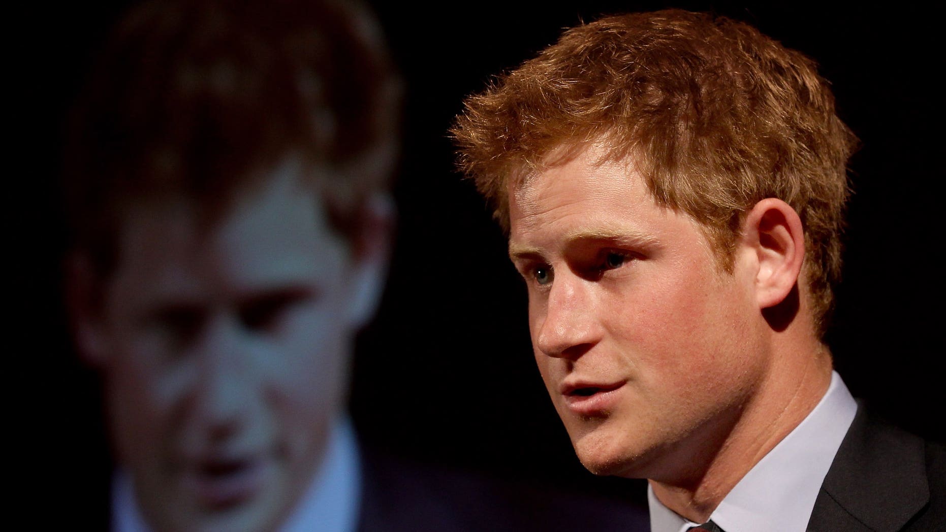 Britain's Prince Harry makes a speech at the Friends of the Forces Awards in London on July 13, 2010. The royal will visit Australia next month for events in Sydney marking the Royal Australian Navy's centenary of service, Australian Prime Minister Tony Abbott has said.