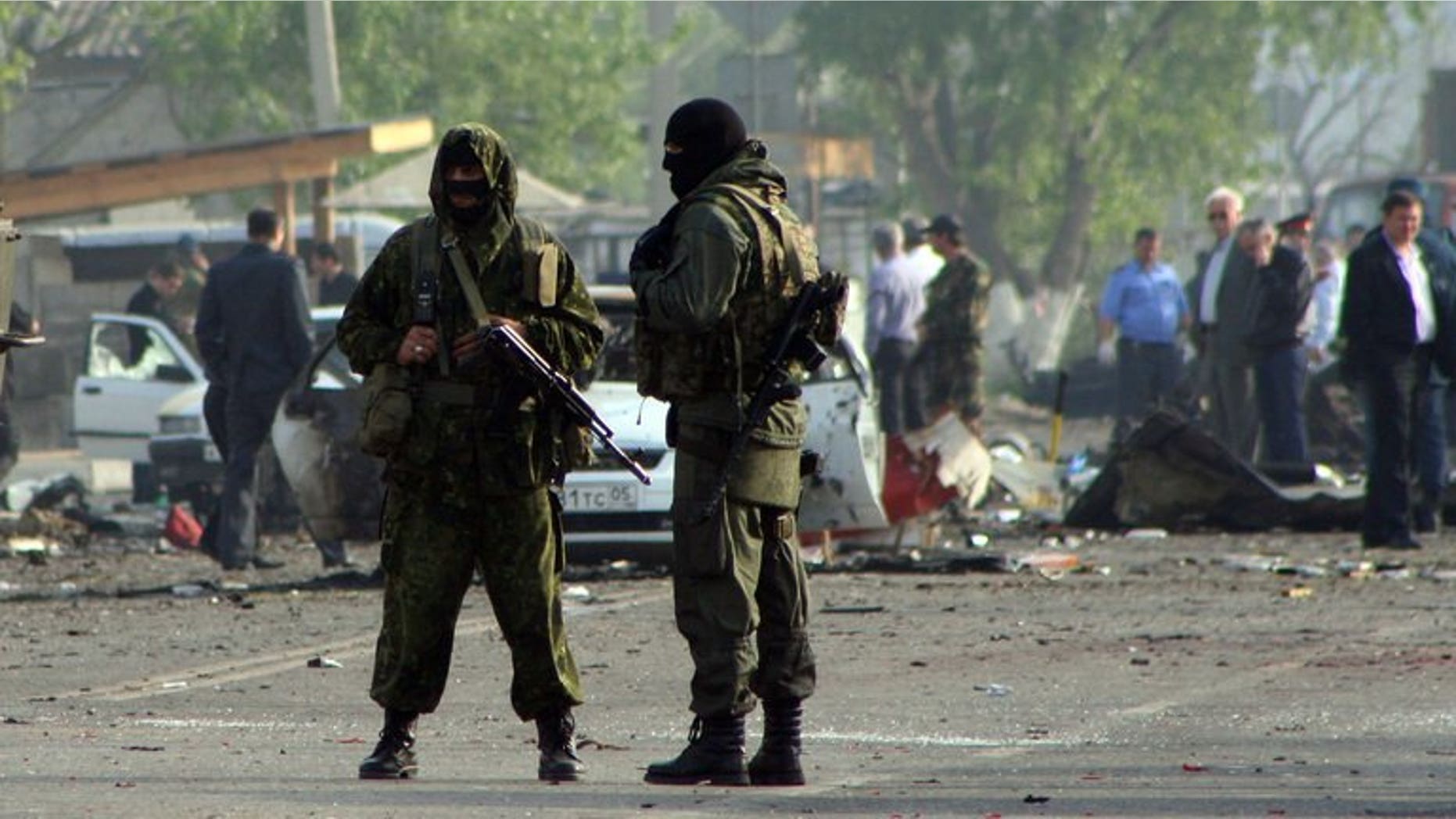 File picture shows special forces officers guarding the site of two blasts in the Dagestan's capital Makhachkala early on May 4, 2012.