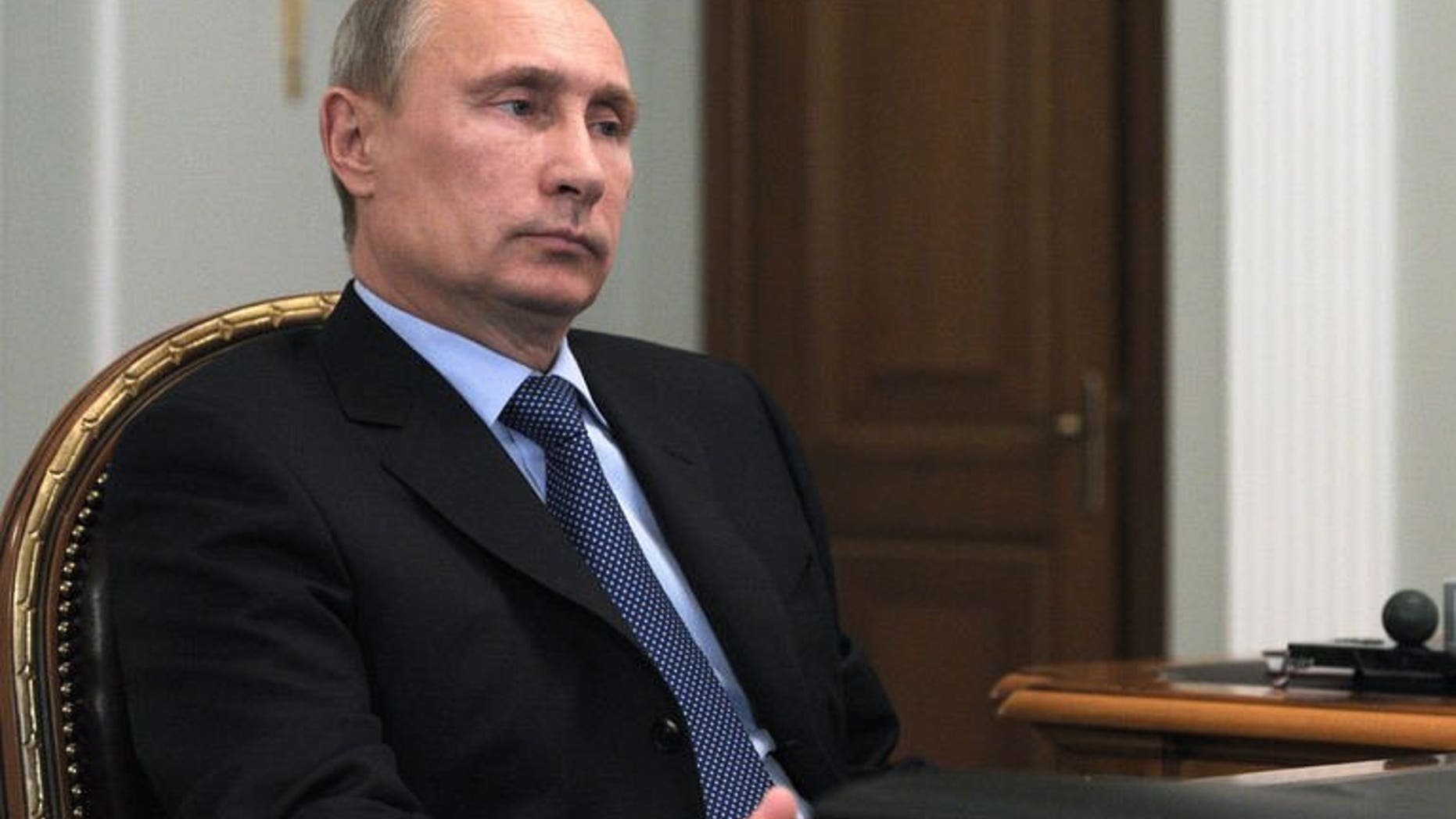 Russia's President Vladimir Putin attends a meeting in his Novo-Ogaryovo residence outside Moscow, on September 20, 2013.