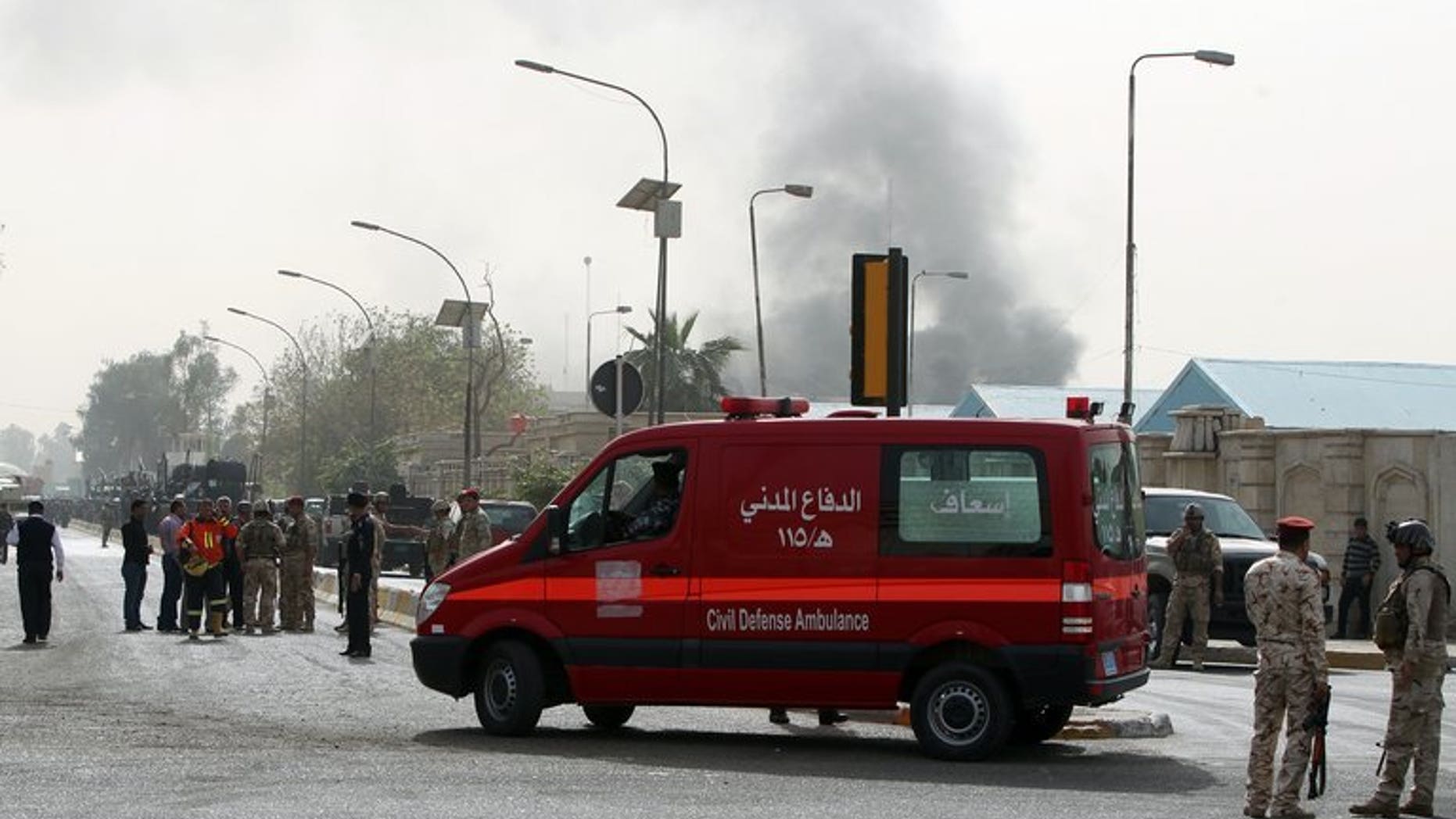 File picture shows an ambulance arriving at the scene of a bomb attack in Baghdad, on March 14, 2013. A bomb exploded near an ambulance taking a pregnant woman to hospital in Iraq on Monday, wounding her and killing two people, police and a doctor said.