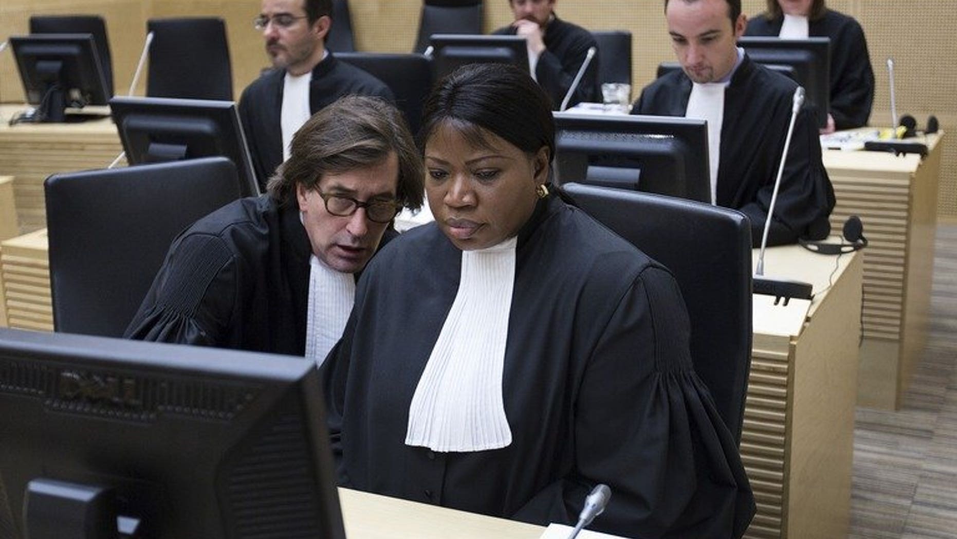 International Criminal Court Prosecutor Fatou Bensouda (right) and senior trial lawyer Eric Mac Donald on February 19, 2013 in The Hague. Bensouda offered Tuesday to help prosecute those behind the deadly attack on Nairobi's Westgate shopping mall, a statement said.