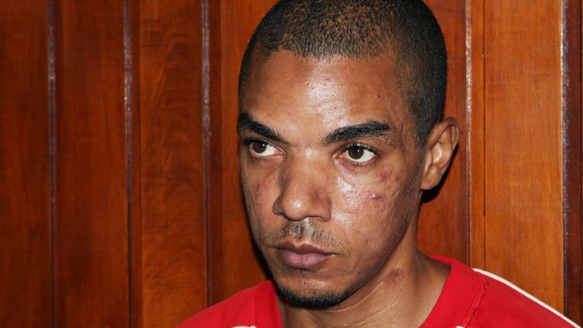 Briton Jermaine Grant sits in court in Kenya's coastal town of Mombasa on May 9, 2012. Grant, accused of ties to Somalia's Al-Qaeda-linked Shebab, appeared in a Kenyan court on Tuesday on explosives charges.