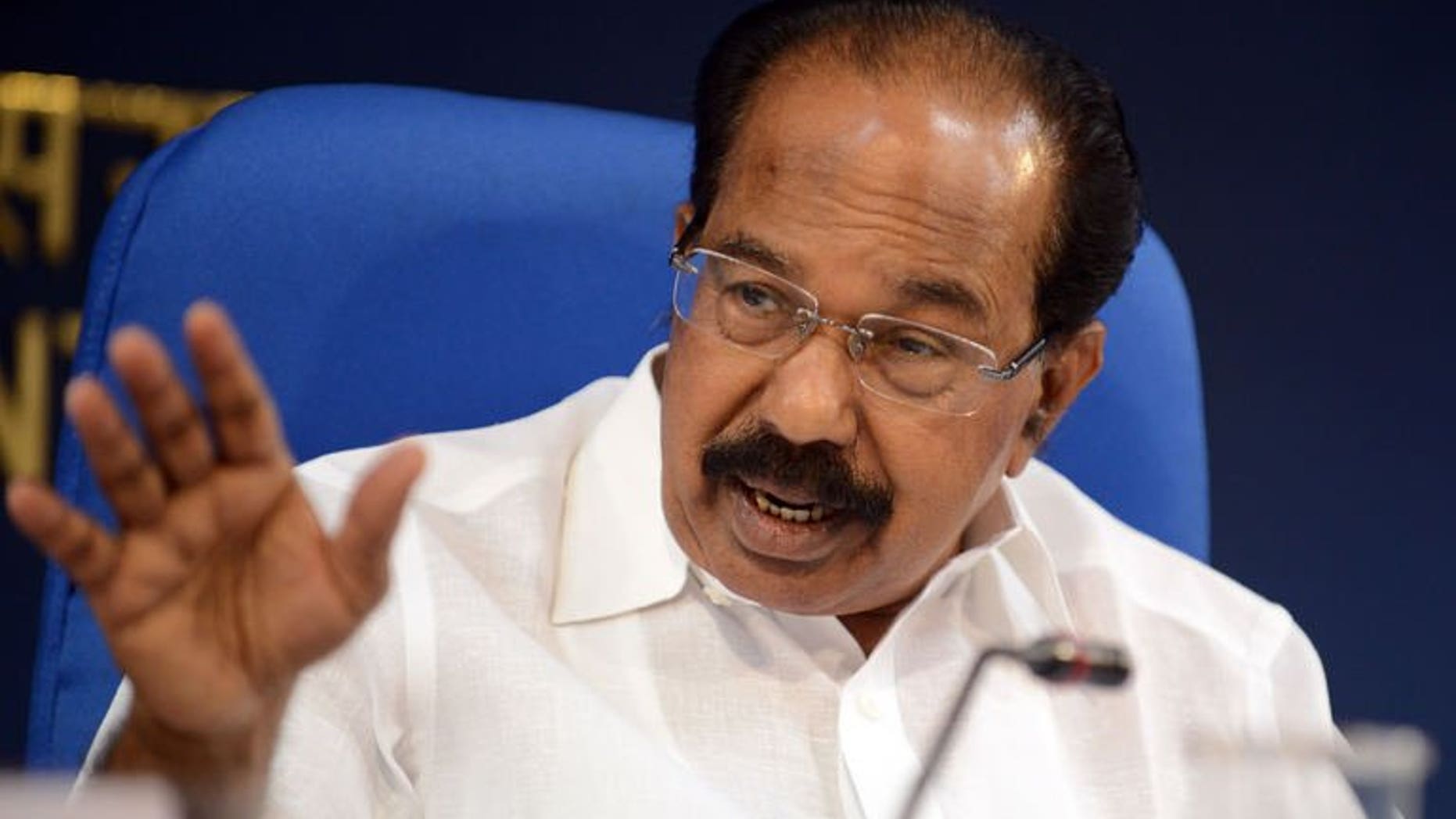 Indian Minister for Petroleum and Natural Gas, Veerappa Moily addresses a press conference during the unveiling of a mega fuel conservation campaign in New Delhi on September 24, 2013.