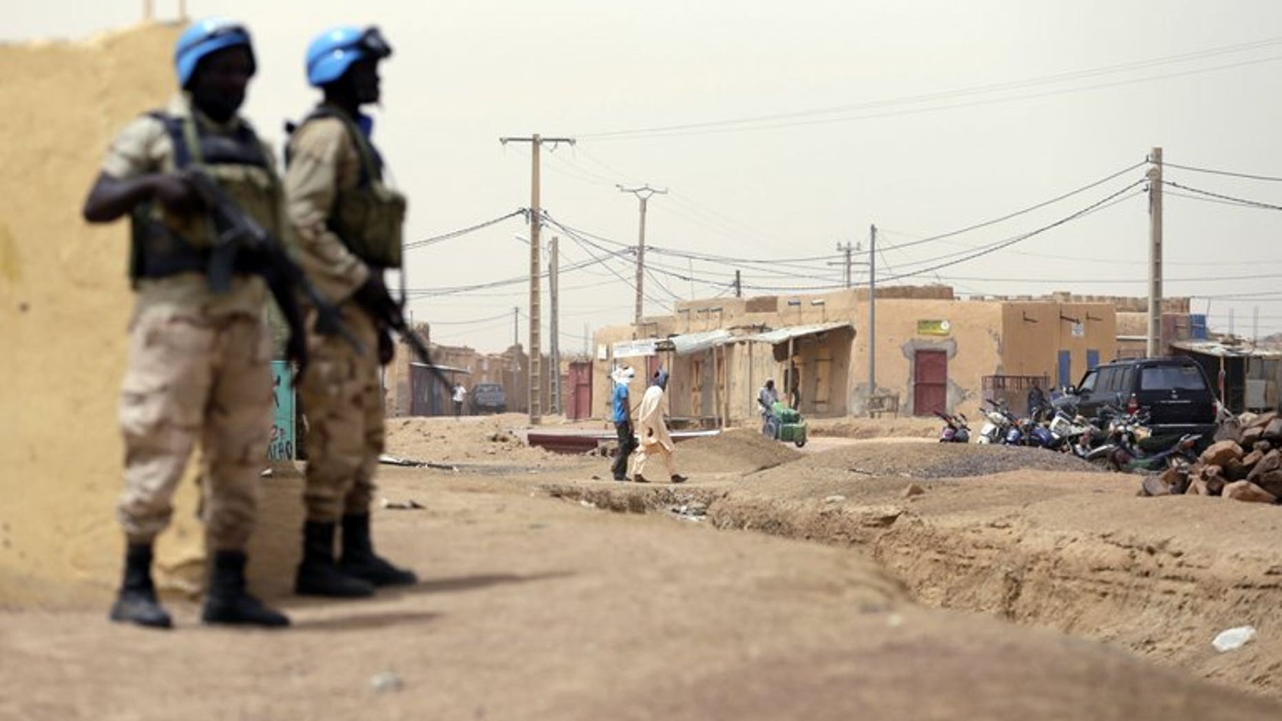 United Nations soldiers patrol on July 27, 2013 in the northern Malian city of Kidal.