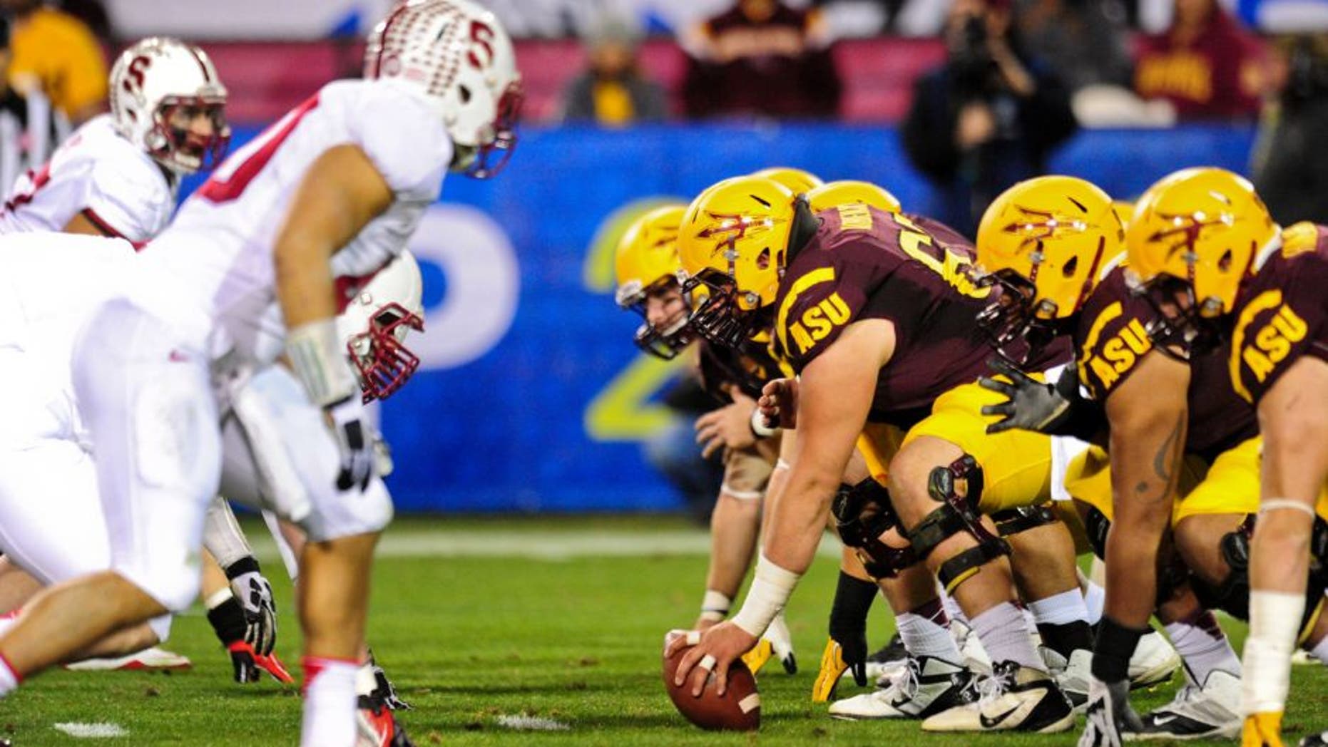 Dec 7, 2013; Tempe, AZ, USA; The Arizona State Sun Devils offensive line squares off against the Stanford Cardinal defense during the first half at Sun Devil Stadium. Mandatory Credit: Matt Kartozian-USA TODAY Sports