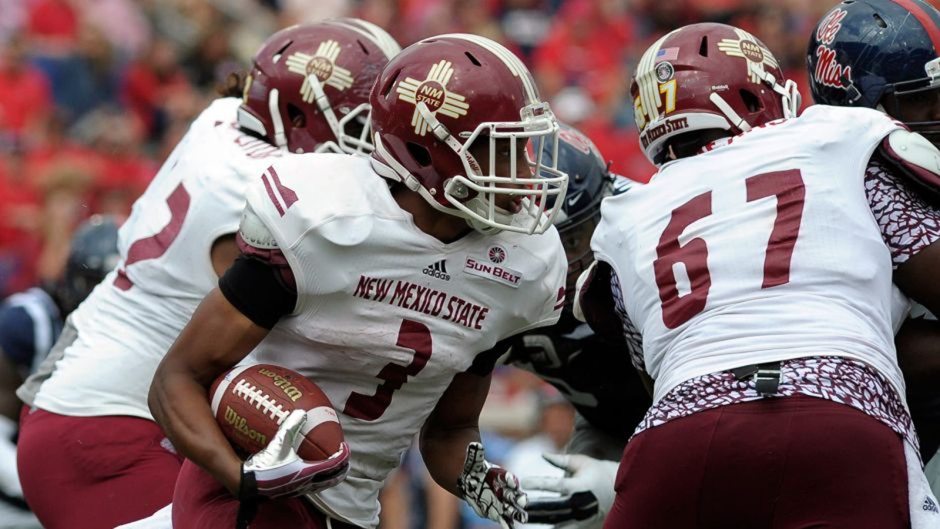 Oct 10, 2015; Oxford, MS, USA; New Mexico State Aggies running back Larry Rose III (3) carries the ball against the Mississippi Rebels during the game at Vaught-Hemingway Stadium. Mississippi Rebels beats New Mexico State Aggies 52-3. Mandatory Credit: Justin Ford-USA TODAY Sports