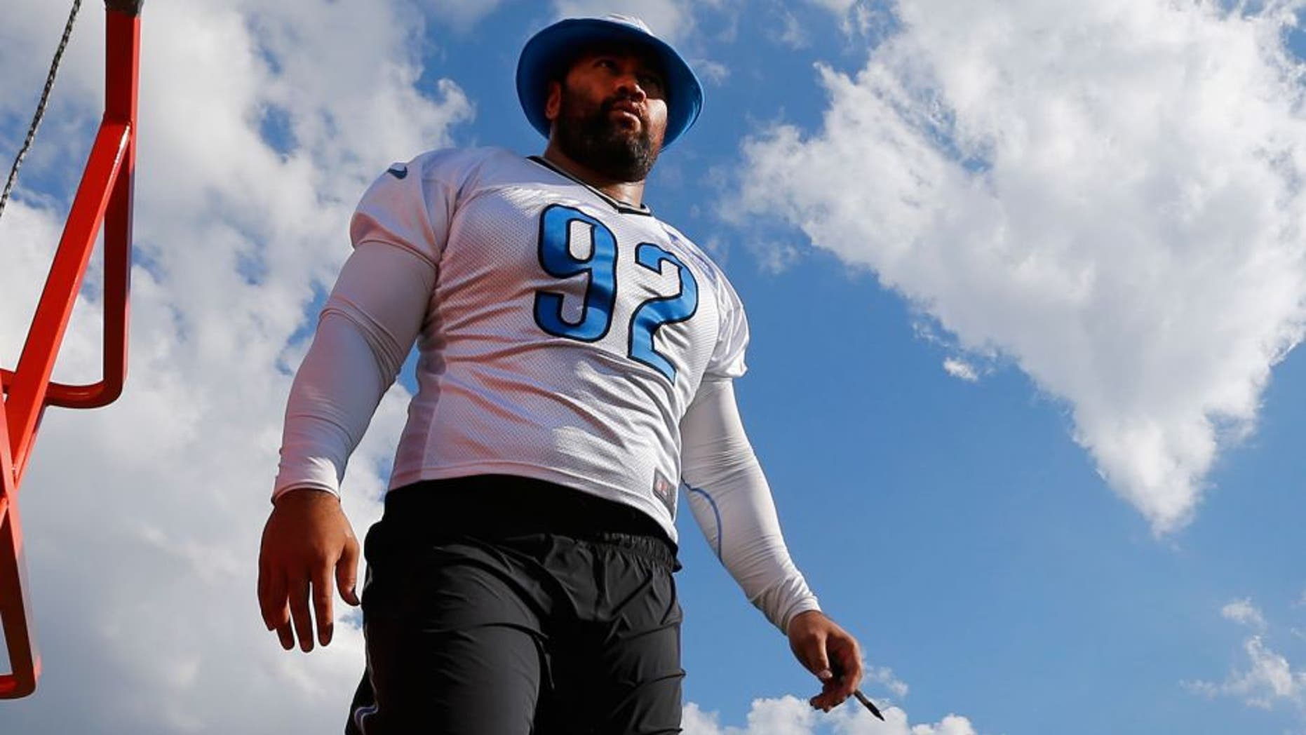 Detroit Lions defensive tackle Haloti Ngata walks on the practice field during NFL football training camp in Allen Park, Mich., Monday, Aug. 3, 2015. (AP Photo/Paul Sancya)