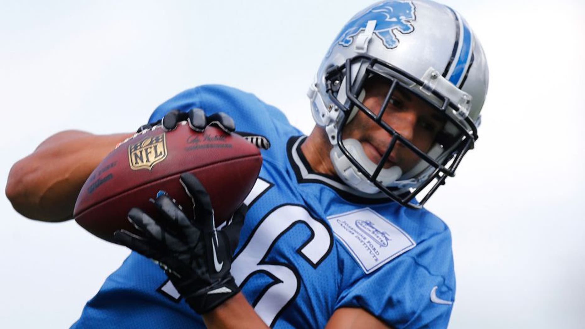 Detroit Lions wide receiver Lance Moore catches a pass during NFL football training camp in Allen Park, Mich., Monday, Aug. 3, 2015. (AP Photo/Paul Sancya)
