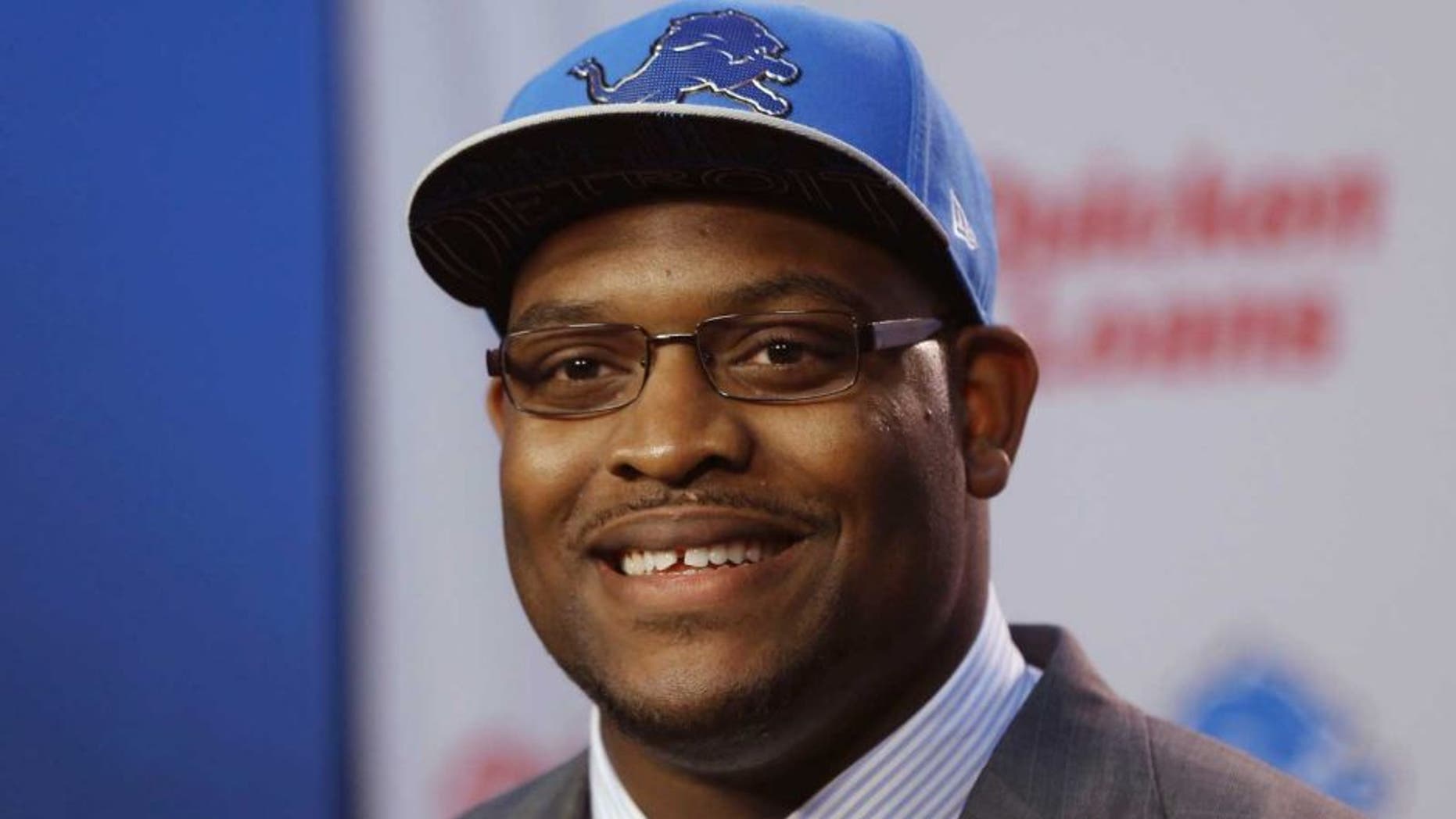 Detroit Lions first round draft pick guard Laken Tomlinson addresses the media during a news conference on Friday, May 1, 2015 in Allen Park, Mich. (AP Photo/Carlos Osorio)