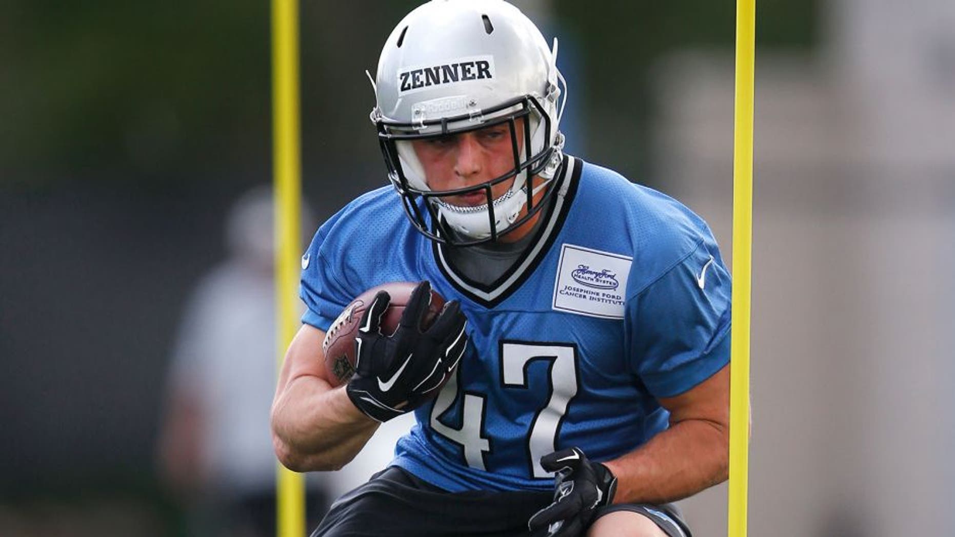 Detroit Lions running back Zach Zenner runs a drill during an NFL football rookie minicamp practice in Allen Park, Mich., Friday, May 8, 2015. (AP Photo/Paul Sancya)