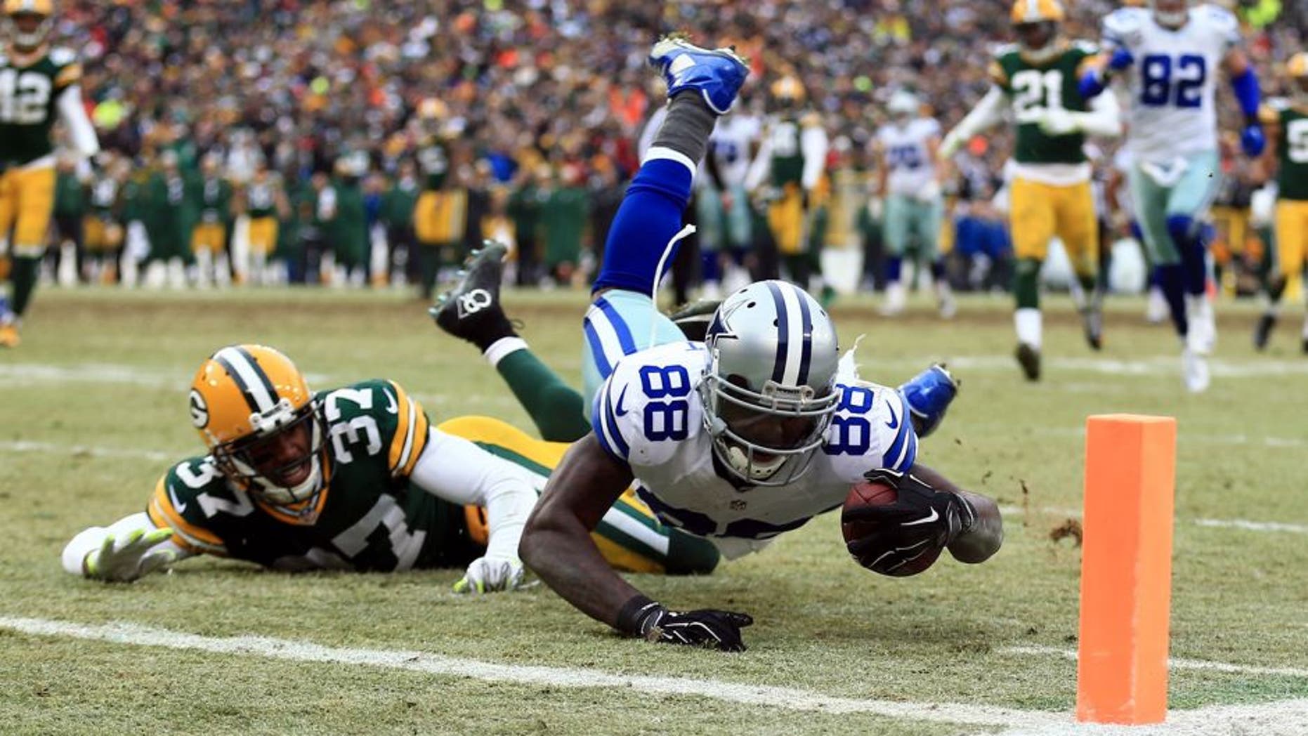 Jan 11, 2015; Green Bay, WI, USA; Dallas Cowboys wide receiver Dez Bryant (88) is unable to catch a pass against Green Bay Packers cornerback Sam Shields (37) in the fourth quarter in the 2014 NFC Divisional playoff football game at Lambeau Field. Mandatory Credit: Andrew Weber-USA TODAY Sports