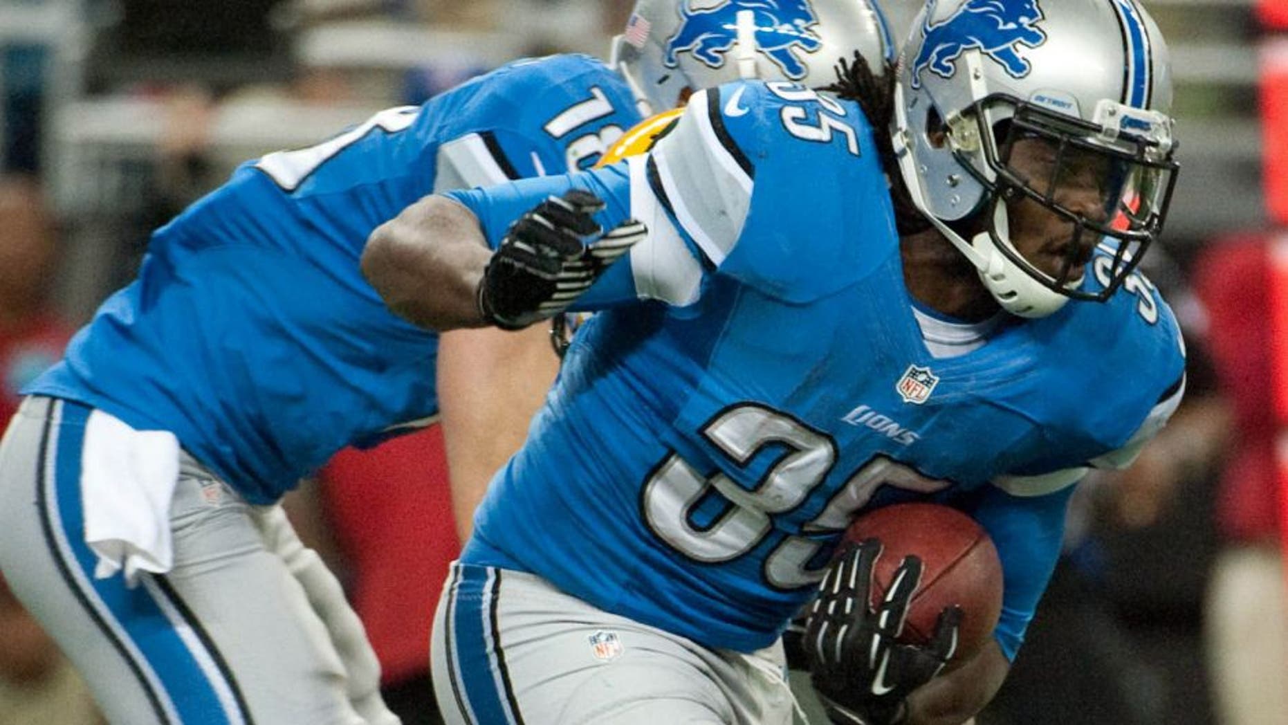 Nov 28, 2013; Detroit, MI, USA; Detroit Lions running back Joique Bell (35) runs the ball during the first quarter against the Green Bay Packers during a NFL football game on Thanksgiving at Ford Field. Mandatory Credit: Tim Fuller-USA TODAY Sports