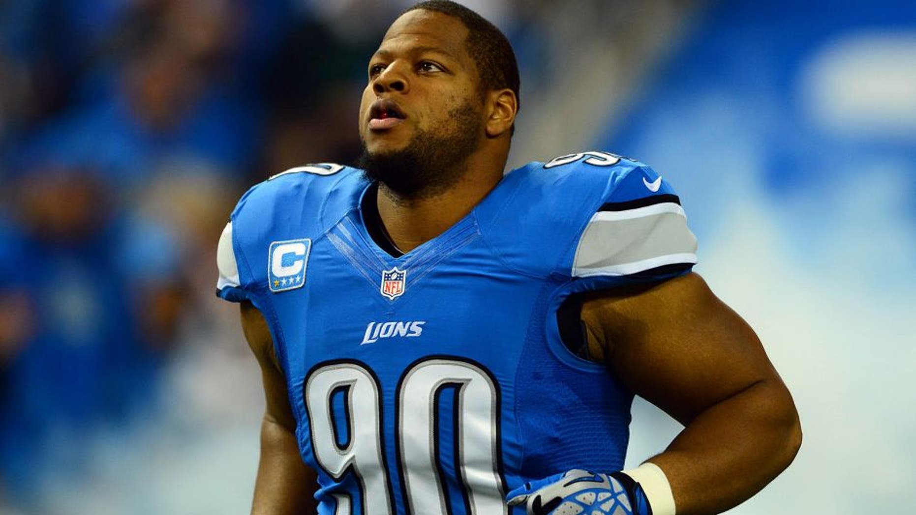 Oct 27, 2013; Detroit, MI, USA; Detroit Lions defensive tackle Ndamukong Suh (90) during player introductions prior to the game against the Dallas Cowboys at Ford Field. Mandatory Credit: Andrew Weber-USA TODAY Sports