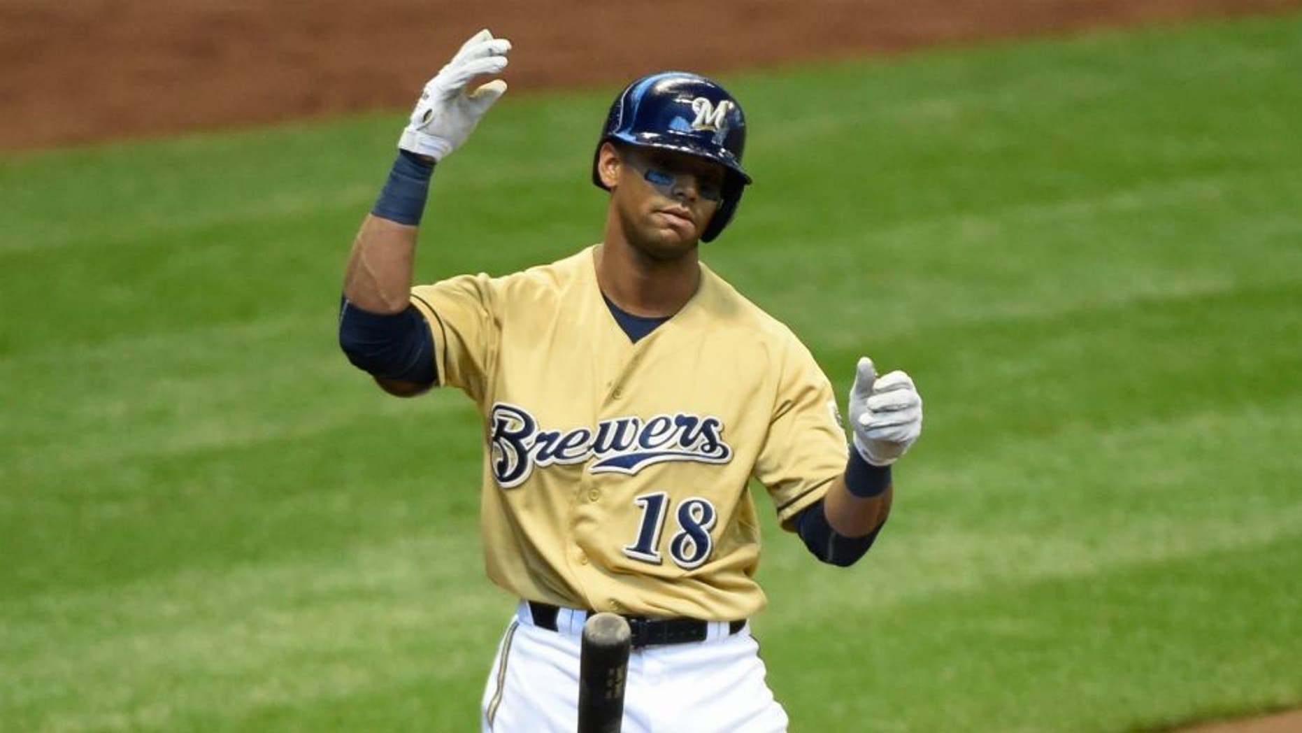 Apr 26, 2015; Milwaukee, WI, USA; Milwaukee Brewers left fielder Khris Davis (18) reacts after striking out in the first inning during the game against the St. Louis Cardinals at Miller Park. Mandatory Credit: Benny Sieu-USA TODAY Sports