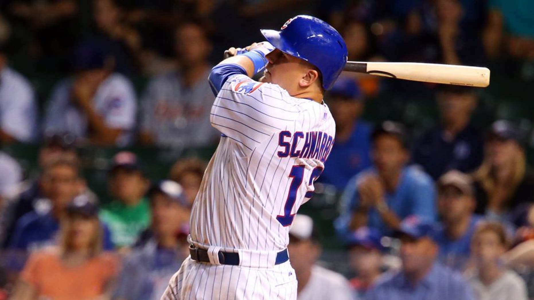 Aug 18, 2015; Chicago, IL, USA; Chicago Cubs outfielder Kyle Schwarber hits a three-run home run against the Detroit Tigers during the fifth inning at Wrigley Field. Mandatory Credit: Jerry Lai-USA TODAY Sports