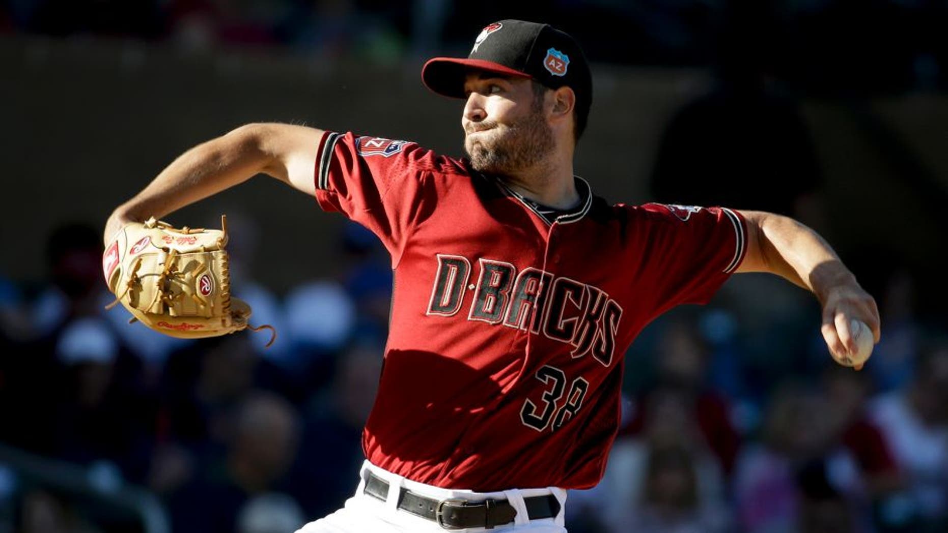 Arizona Diamondbacks starting pitcher Robbie Ray throws against the Los Angeles Angels during first inning of a spring baseball game in Scottsdale, Ariz., Tuesday, March 8, 2016. (AP Photo/Chris Carlson)