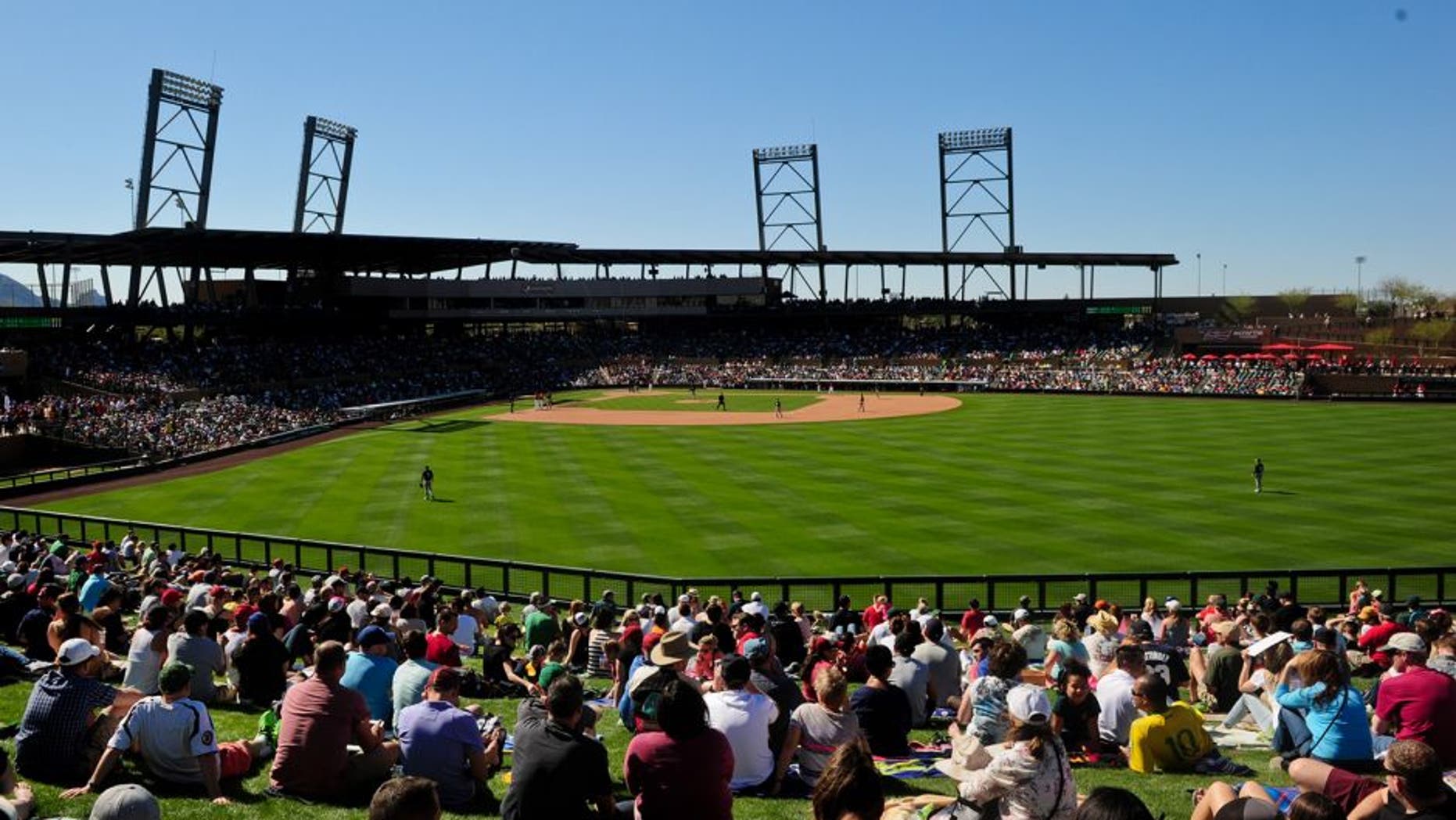 Mar 6, 2015; Salt River Pima-Maricopa, AZ, USA; Fans watch the game between the Arizona Diamondbacks and the Oakland Athletics from the outfield lawn during a spring training baseball game at Salt River Fields at Talking Stick. Mandatory Credit: Matt Kartozian-USA TODAY Sports