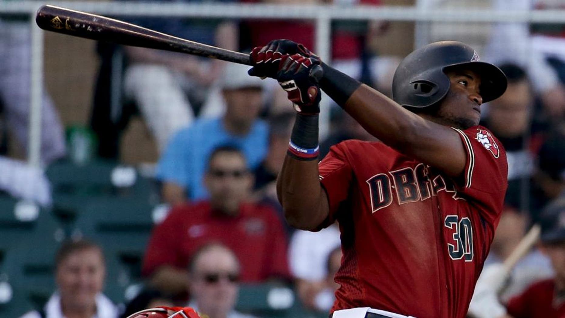 Arizona Diamondbacks' Socrates Brito watches his RBI double against the Los Angeles Angels during third inning of a spring baseball game in Scottsdale, Ariz., Tuesday, March 8, 2016. (AP Photo/Chris Carlson)