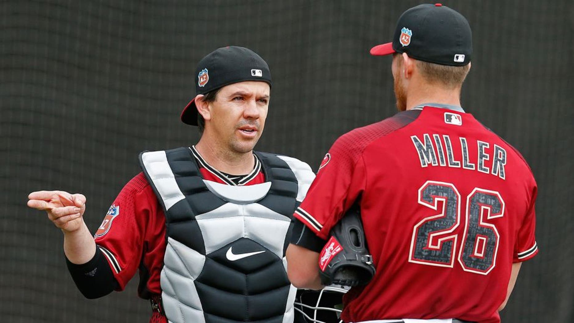 Feb 19, 2016; Scottsdale, AZ, USA; Arizona Diamondbacks catcher Tuffy Gosewisch (8) talks to pitcher Shelby Miller (26) during spring training camp at Salt River Fields. Mandatory Credit: Rick Scuteri-USA TODAY Sports