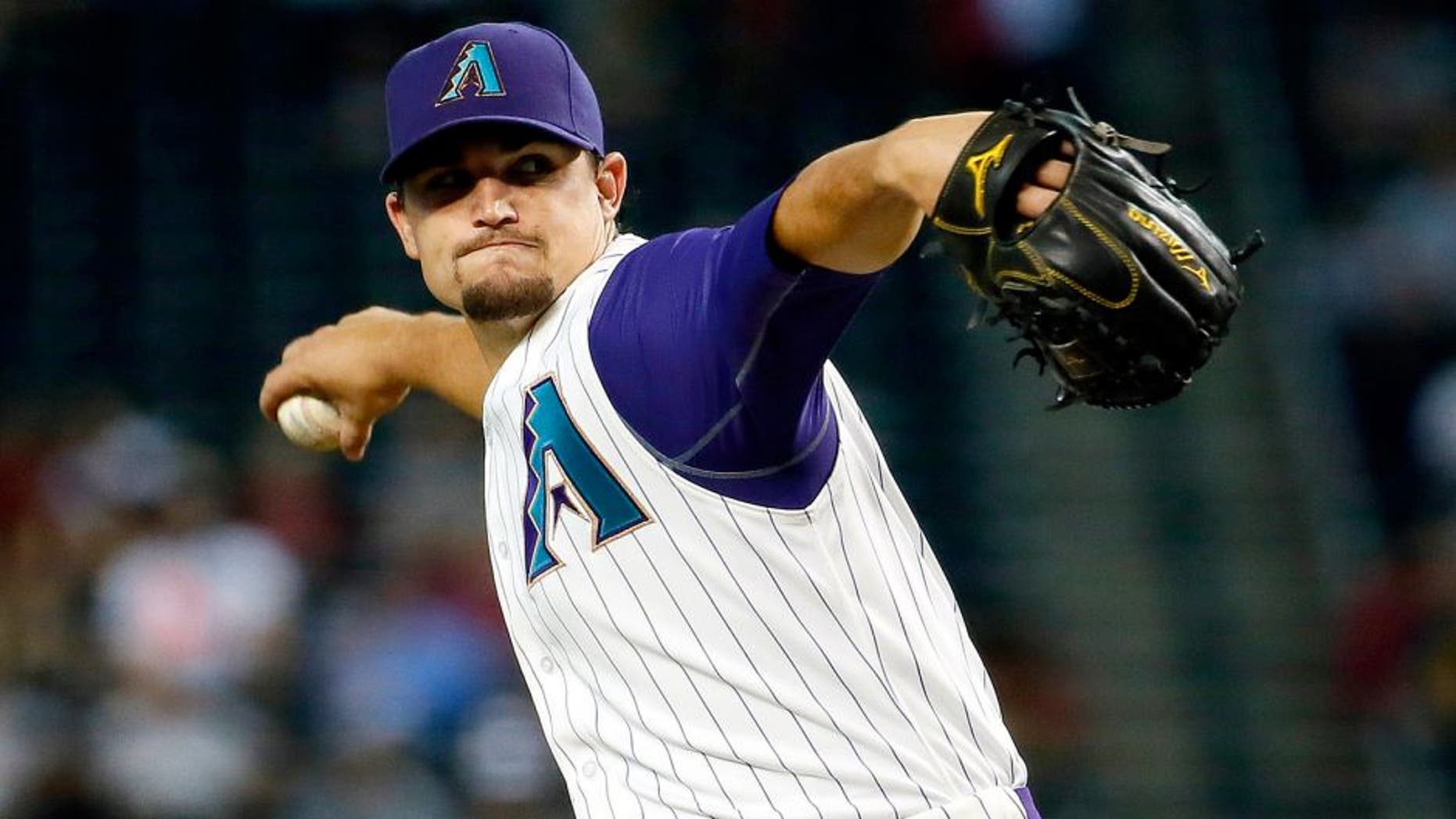 Arizona Diamondbacks pitcher Zack Godley throws during the first inning of a baseball game against the Milwaukee Brewers, Thursday, July 23, 2015, in Phoenix. (AP Photo/Matt York)