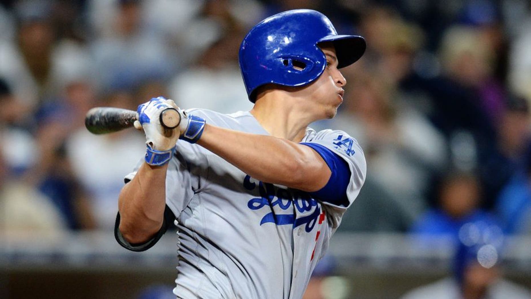 Apr 6, 2016; San Diego, CA, USA; Los Angeles Dodgers shortstop Corey Seager (5) follows through during the seventh inning against the San Diego Padres at Petco Park. Mandatory Credit: Jake Roth-USA TODAY Sports