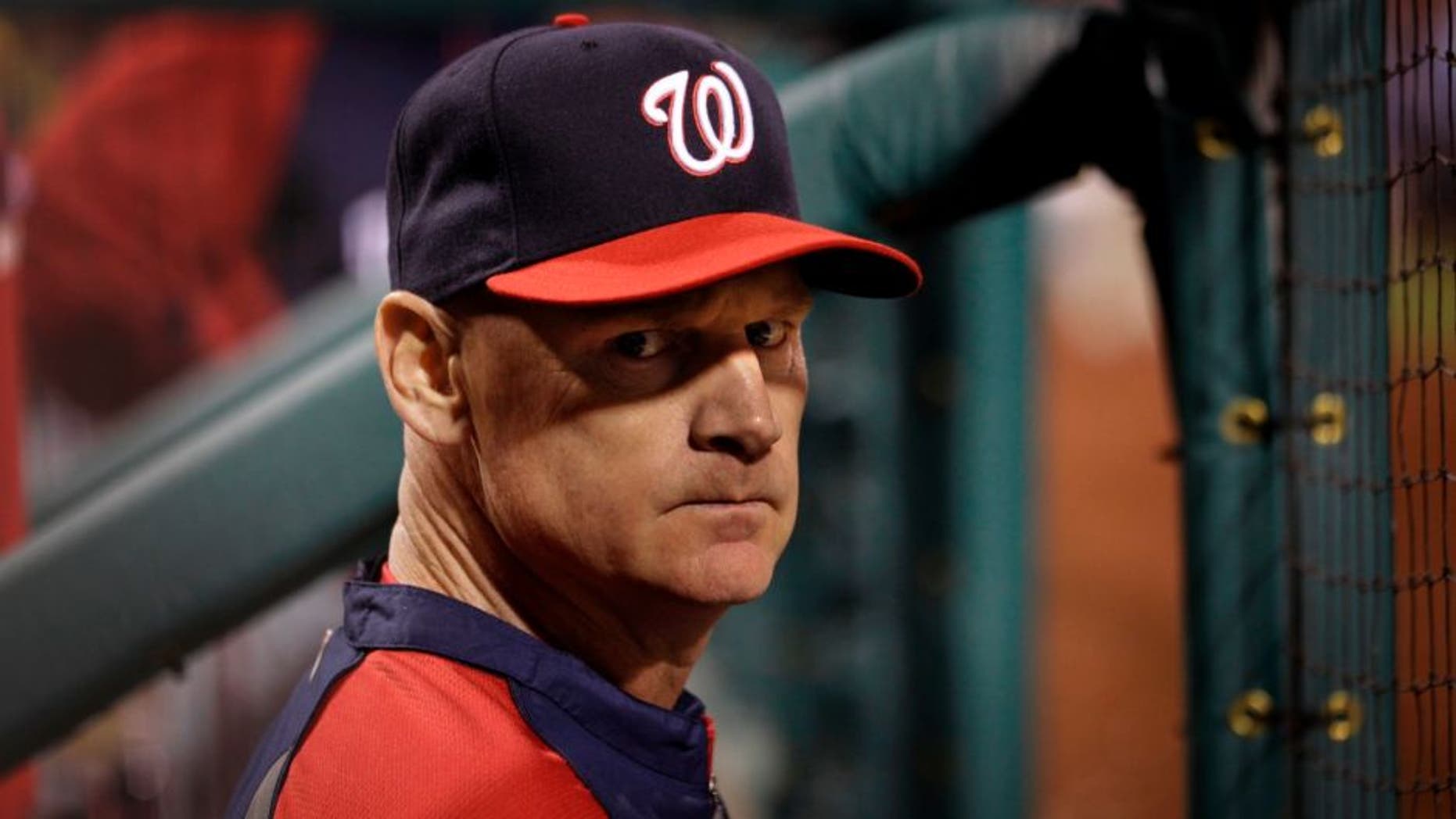May 11, 2014; Oakland, CA, USA; Washington Nationals manager Matt Williams (9) stands in the dugout against the Oakland Athletics during the sixth inning at O.co Coliseum. The Athletics defeated the Nationals 9-1. Mandatory Credit: Kyle Terada-USA TODAY Sports
