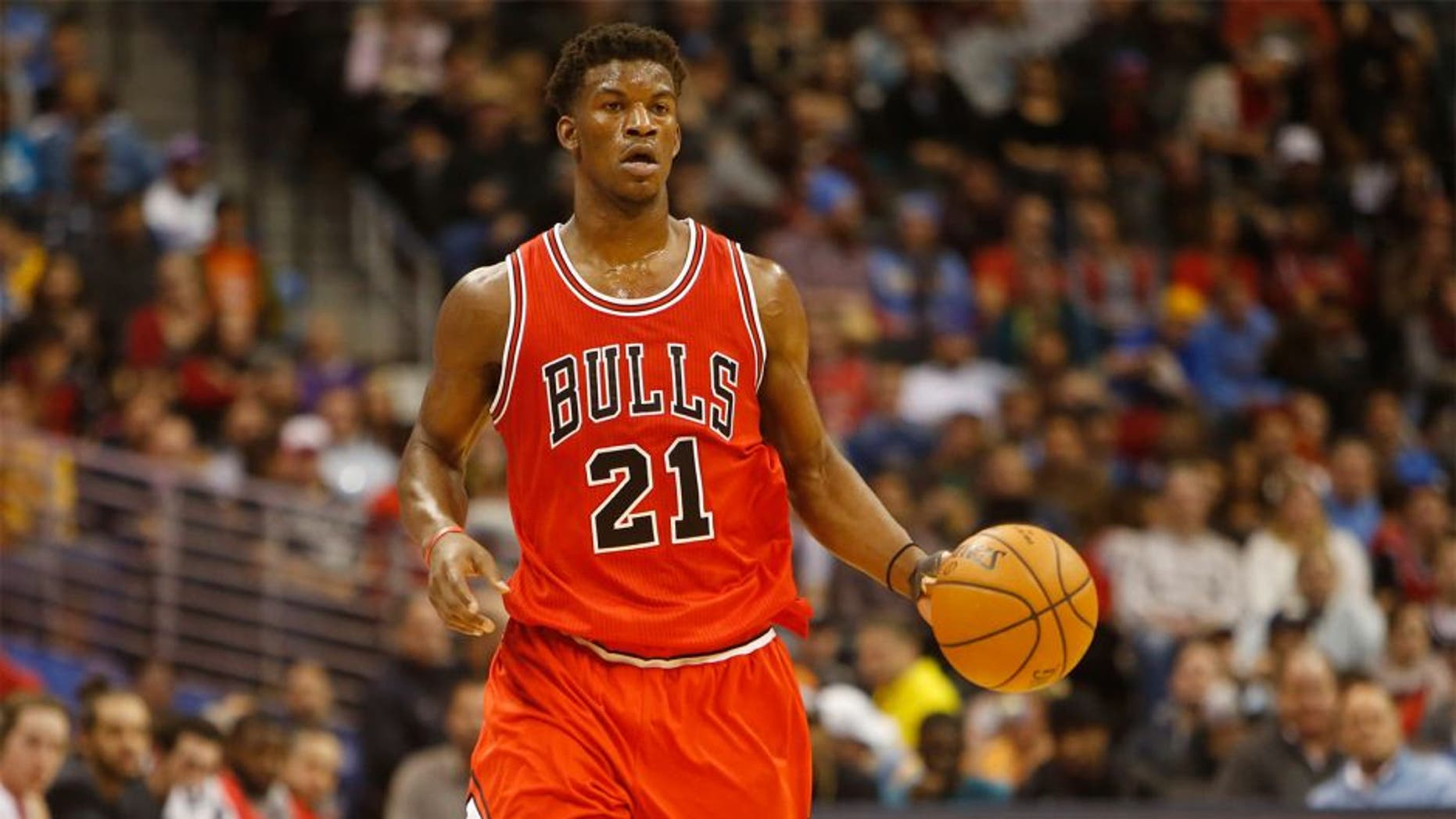 Nov 25, 2014; Denver, CO, USA; Chicago Bulls guard Jimmy Butler (21) during the game against the Denver Nuggets at Pepsi Center. Mandatory Credit: Chris Humphreys-USA TODAY Sports