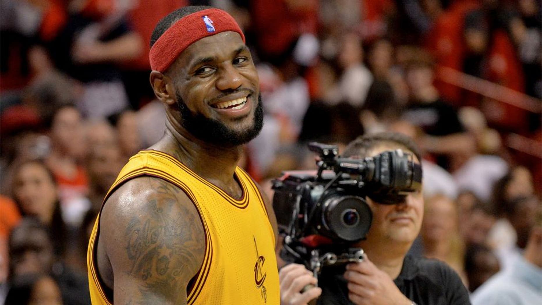 Dec 25, 2014; Miami, FL, USA; Cleveland Cavaliers forward LeBron James (23) smiles after losing to the Miami Heat at American Airlines Arena. The Heat won 101-91. Mandatory Credit: Steve Mitchell-USA TODAY Sports