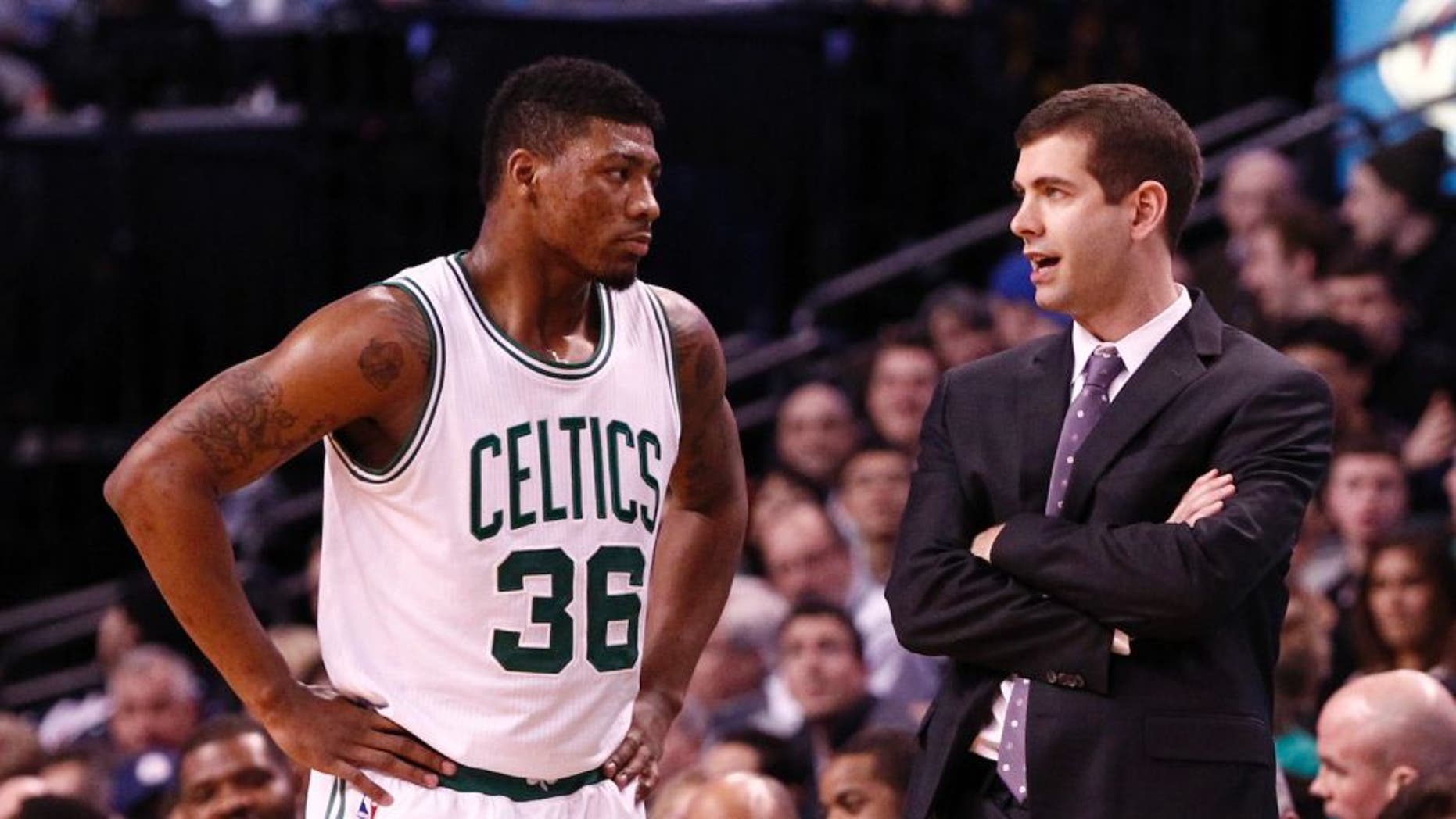 Jan 30, 2015; Boston, MA, USA; Boston Celtics head coach Brad Stevens (right) speaks to guard Marcus Smart (36) during the second half of a game against the Houston Rockets at TD Garden. Mandatory Credit: Mark L. Baer-USA TODAY Sports