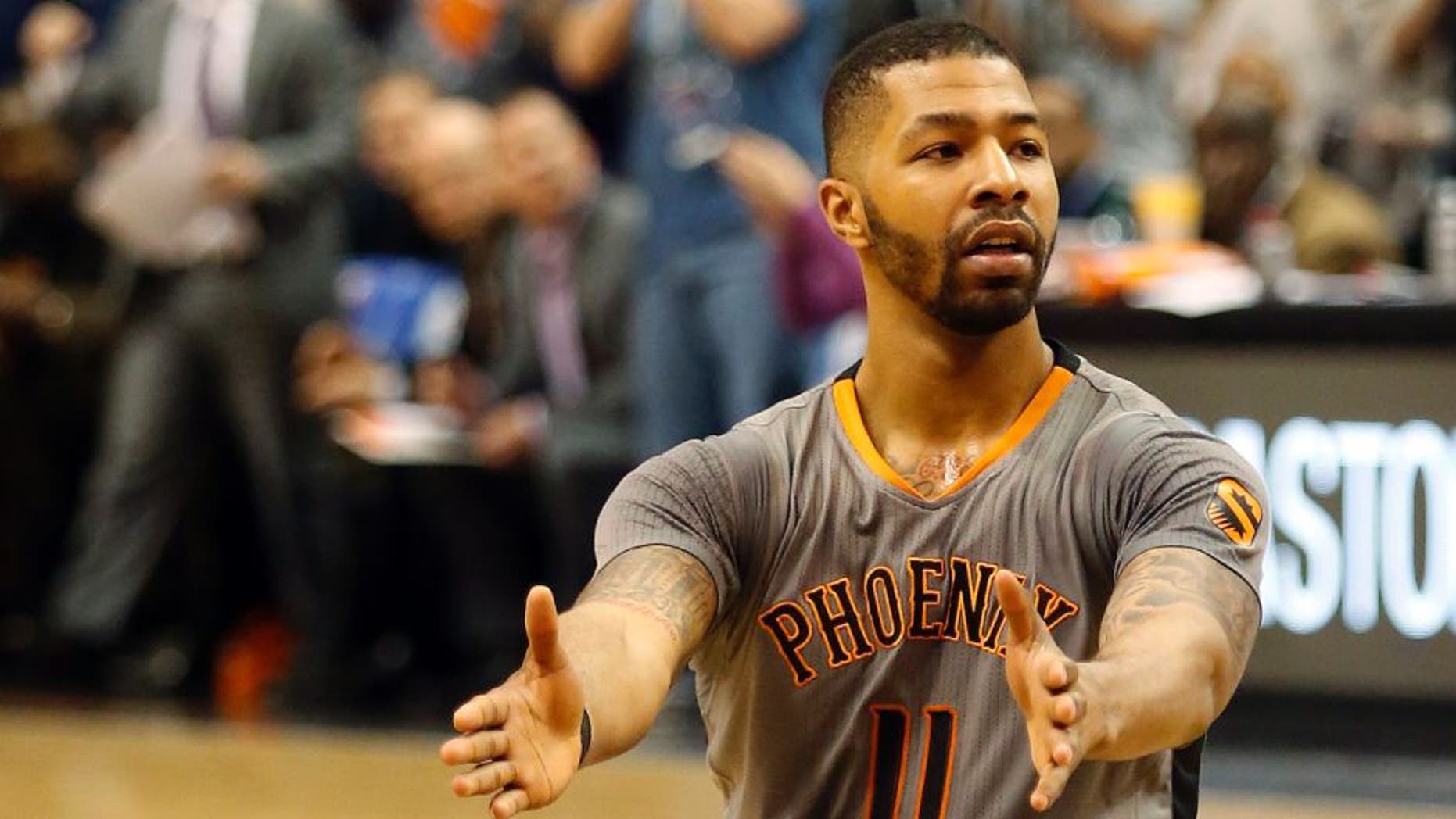 Feb 26, 2015; Phoenix, AZ, USA; Phoenix Suns forward Markieff Morris (11) reacts after scoring against the Oklahoma City Thunder during the fourth quarter at US Airways Center. Mandatory Credit: Rick Scuteri-USA TODAY Sports