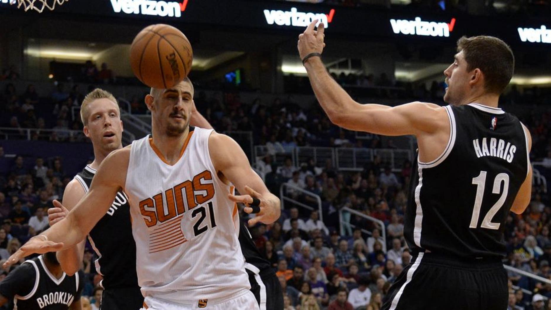 Nov 12, 2016; Phoenix, AZ, USA; Phoenix Suns center Alex Len (21) and Brooklyn Nets forward Joe Harris (12) go after a loose ball during the second half at Talking Stick Resort Arena. The Nets won 122-104. Mandatory Credit: Joe Camporeale-USA TODAY Sports