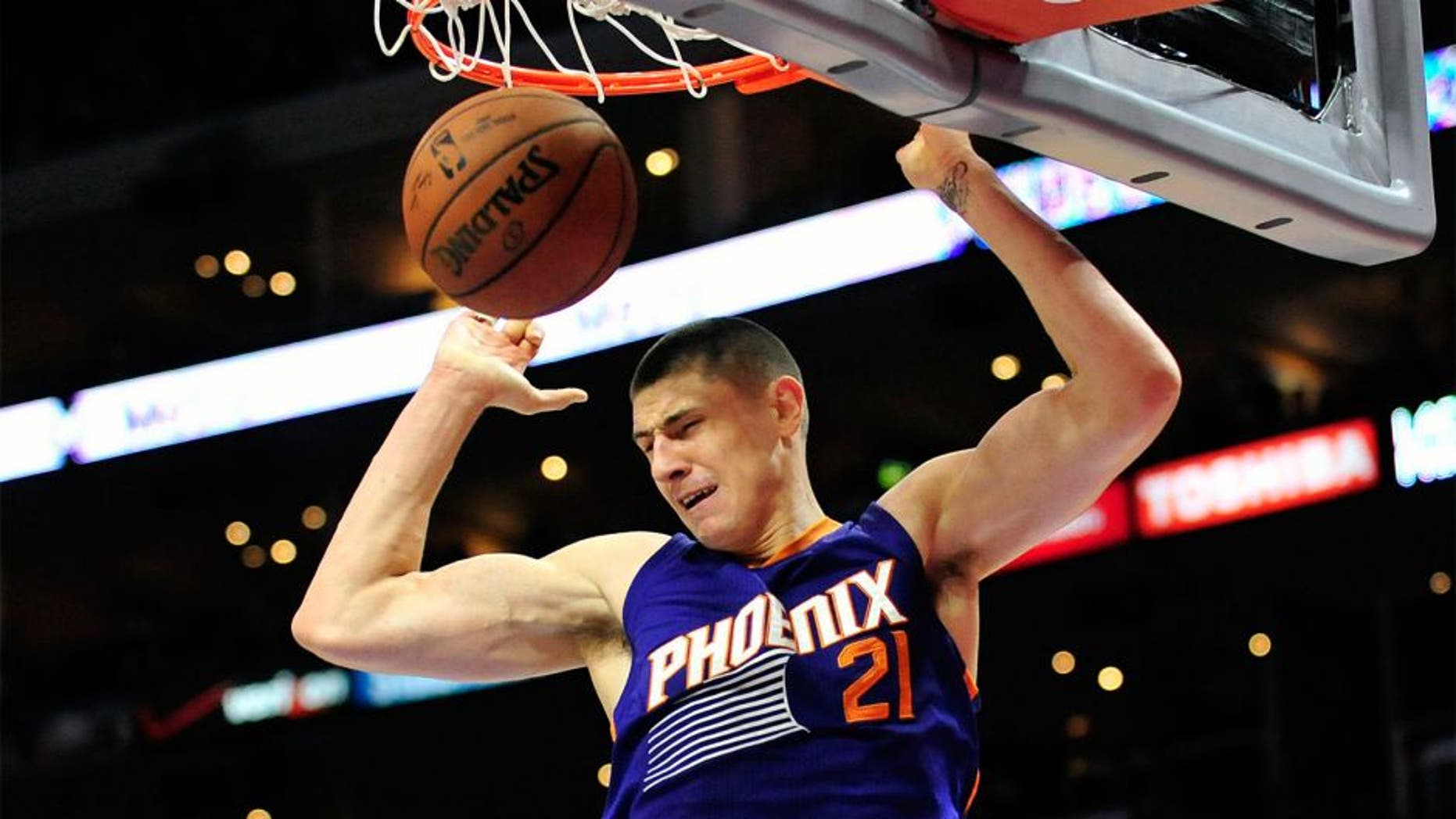 November 15, 2014; Los Angeles, CA, USA; Phoenix Suns center Alex Len (21) dunks to score a basket against the Los Angeles Clippers during the first half at Staples Center. Mandatory Credit: Gary A. Vasquez-USA TODAY Sports