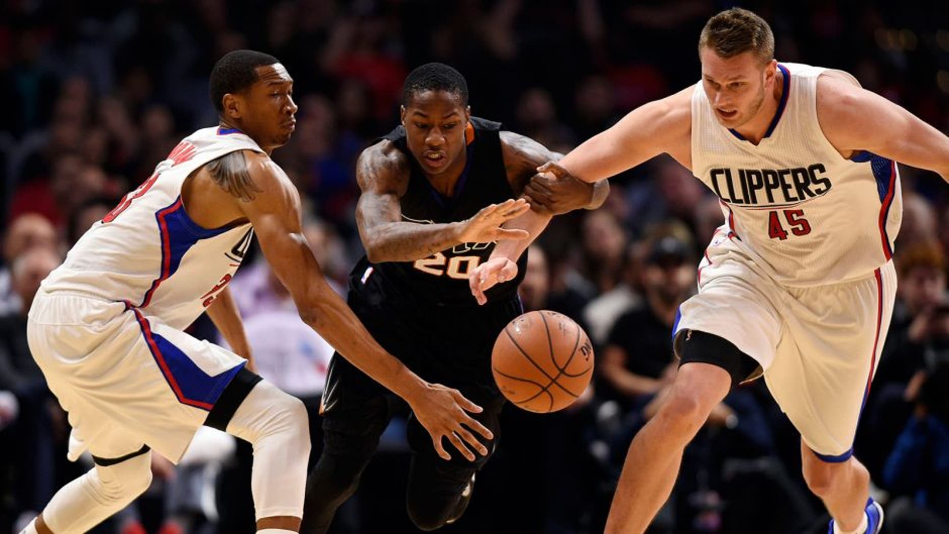 Feb 22, 2016; Los Angeles, CA, USA; Phoenix Suns guard Archie Goodwin (center) battles with Los Angeles Clippers forward Wesley Jonson (left) and center Cole Aldrich (right) for the loose ball during the fourth quarter at Staples Center. The Los Angeles Clippers won 124-84. Mandatory Credit: Kelvin Kuo-USA TODAY Sports