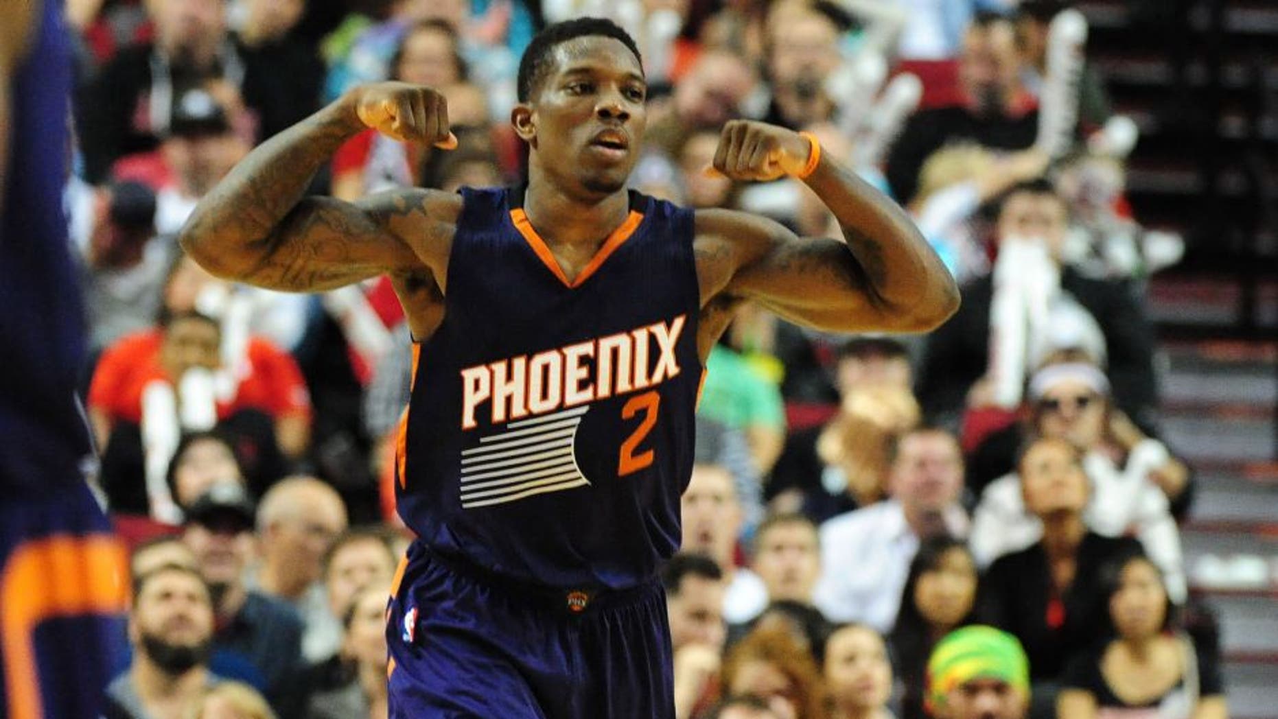 Phoenix Suns guard Eric Bledsoe (2) celebrates after hitting a shot during the fourth quarter of an NBA basketball game against the Portland Trail Blazers in Portland, Ore., Saturday, Oct. 31, 2015. The Suns won the game 101-90. (AP Photo/Steve Dykes)