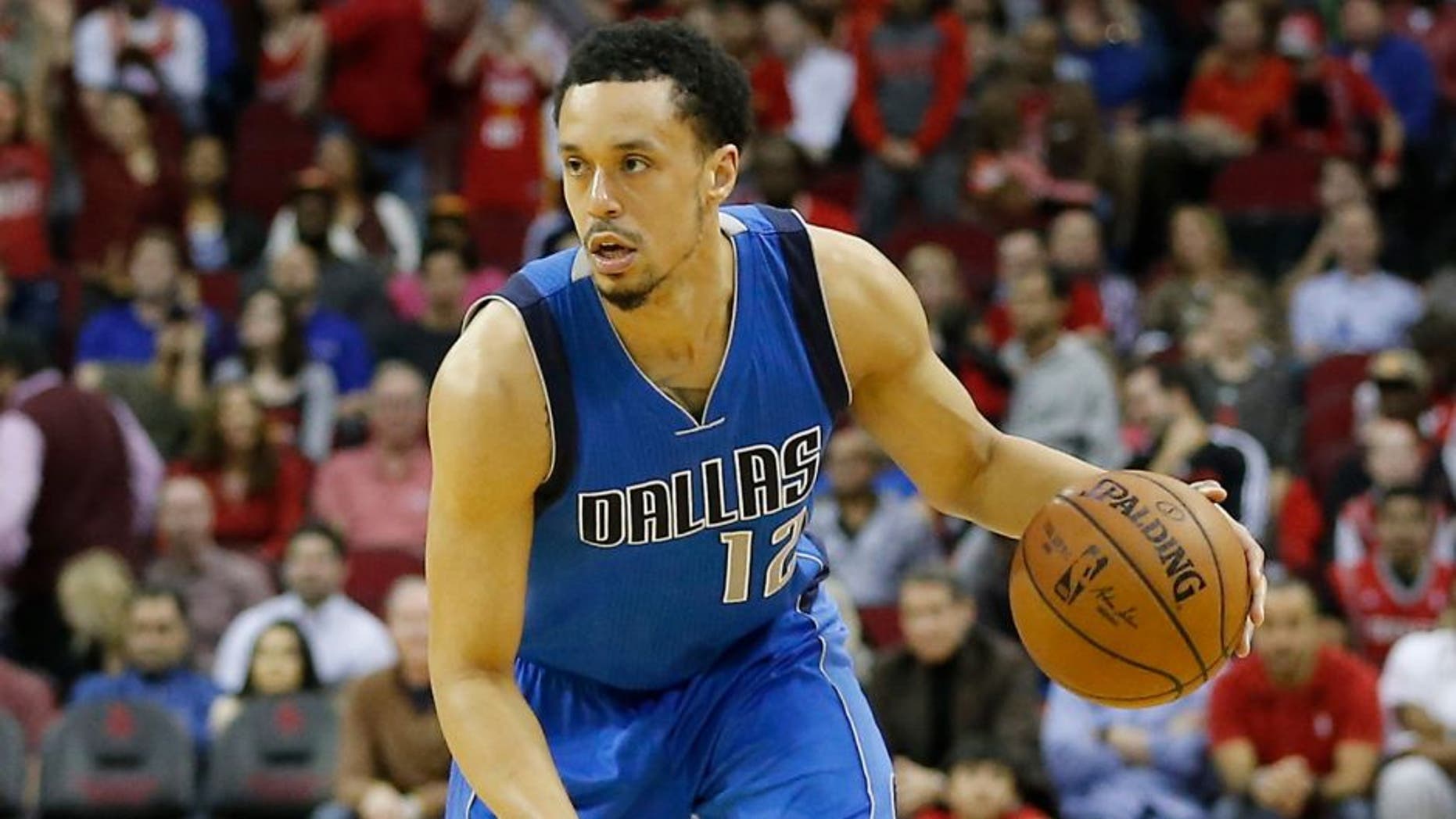 Jan 24, 2016; Houston, TX, USA; Dallas Mavericks guard John Jenkins (12) dribbles against the Houston Rockets at Toyota Center. Mandatory Credit: Thomas B. Shea-USA TODAY Sports