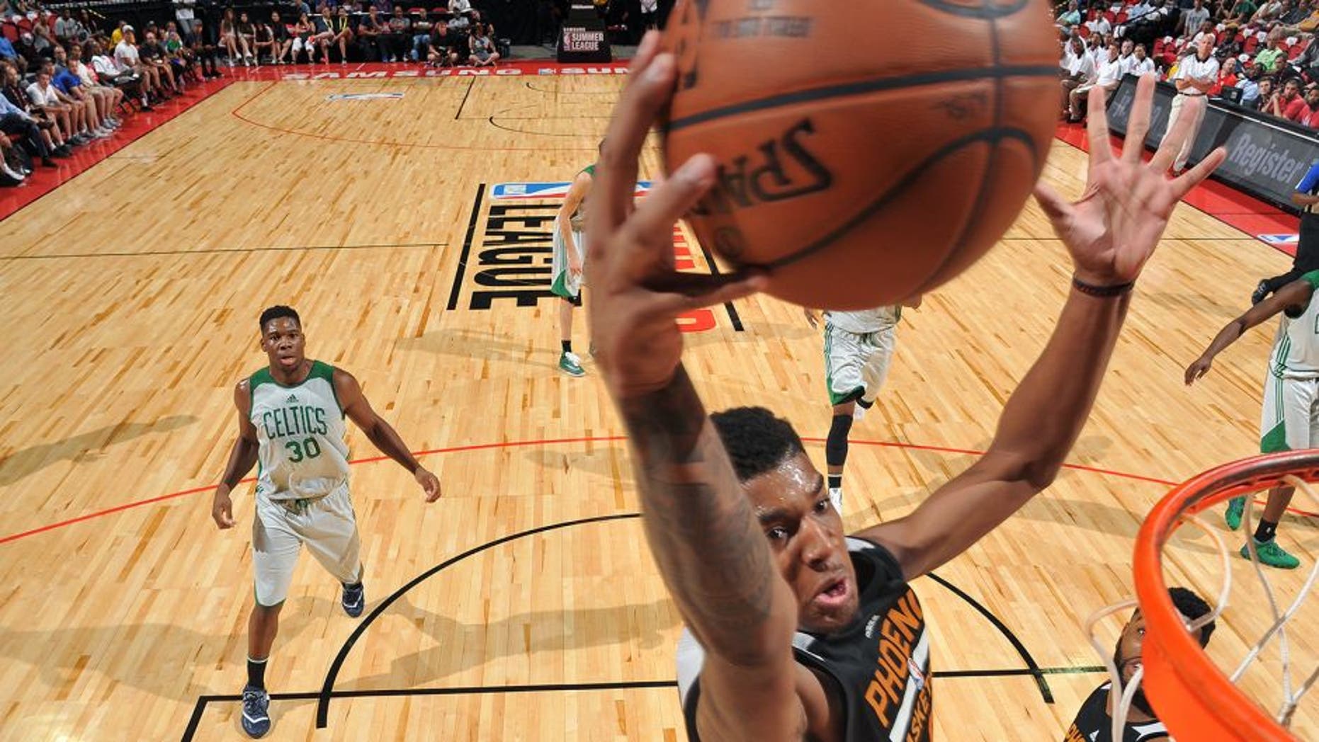 LAS VEGAS, NV - JULY 10: Marquese Chriss #0 of Phoenix Suns goes for the dunk during the game against the Boston Celtics during the 2016 NBA Las Vegas Summer League on July 10, 2016 at the Thomas & Mack Center in Las Vegas, Nevada. NOTE TO USER: User expressly acknowledges and agrees that, by downloading and or using this photograph, user is consenting to the terms and conditions of Getty Images License Agreement. Mandatory Copyright Notice: Copyright 2016 NBAE (Photo by Garrett Ellwood/NBAE via Getty Images)