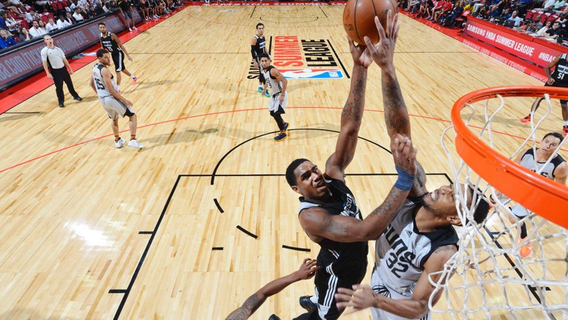 LAS VEGAS, NV - JULY 17: Coty Clarke #44 of the Minnesota Timberwolves shoots the ball against Richard Solomon #32 of the Phoenix Suns during the 2016 NBA Las Vegas Summer League game on July 17, 2016 at the Thomas & Mack Center in Las Vegas, Nevada. NOTE TO USER: User expressly acknowledges and agrees that, by downloading and or using this photograph, User is consenting to the terms and conditions of the Getty Images License Agreement. Mandatory Copyright Notice: Copyright 2016 NBAE (Photo by David Dow/NBAE via Getty Images)