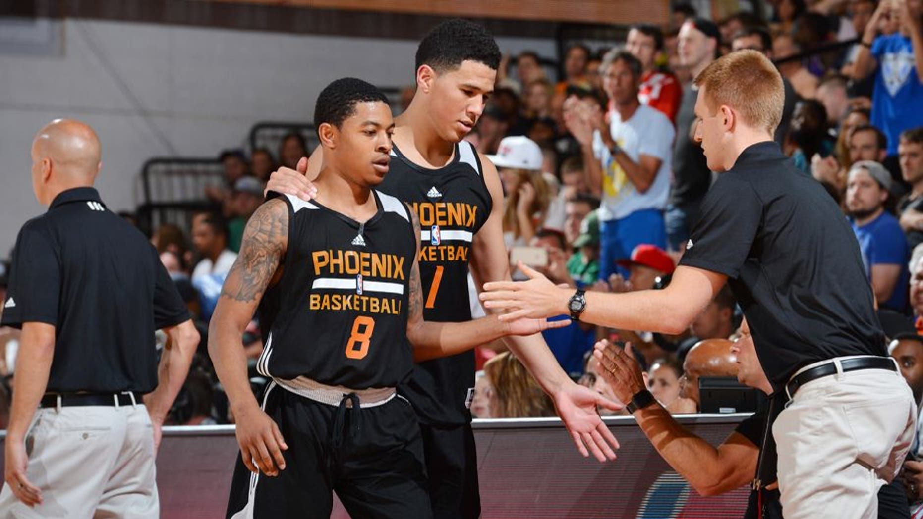 LAS VEGAS, NV - JULY 9: Devin Booker #1 of the Phoenix Suns and Tyler Ulis #8 of the Phoenix Suns shake hands with their teammates during the game against the Portland Trail Blazers during the 2016 NBA Las Vegas Summer League game on July 9, 2016 at the Cox Pavillion in Las Vegas, Nevada. NOTE TO USER: User expressly acknowledges and agrees that, by downloading and or using this photograph, User is consenting to the terms and conditions of the Getty Images License Agreement. Mandatory Copyright Notice: Copyright 2016 NBAE (Photo by David Dow/NBAE via Getty Images)
