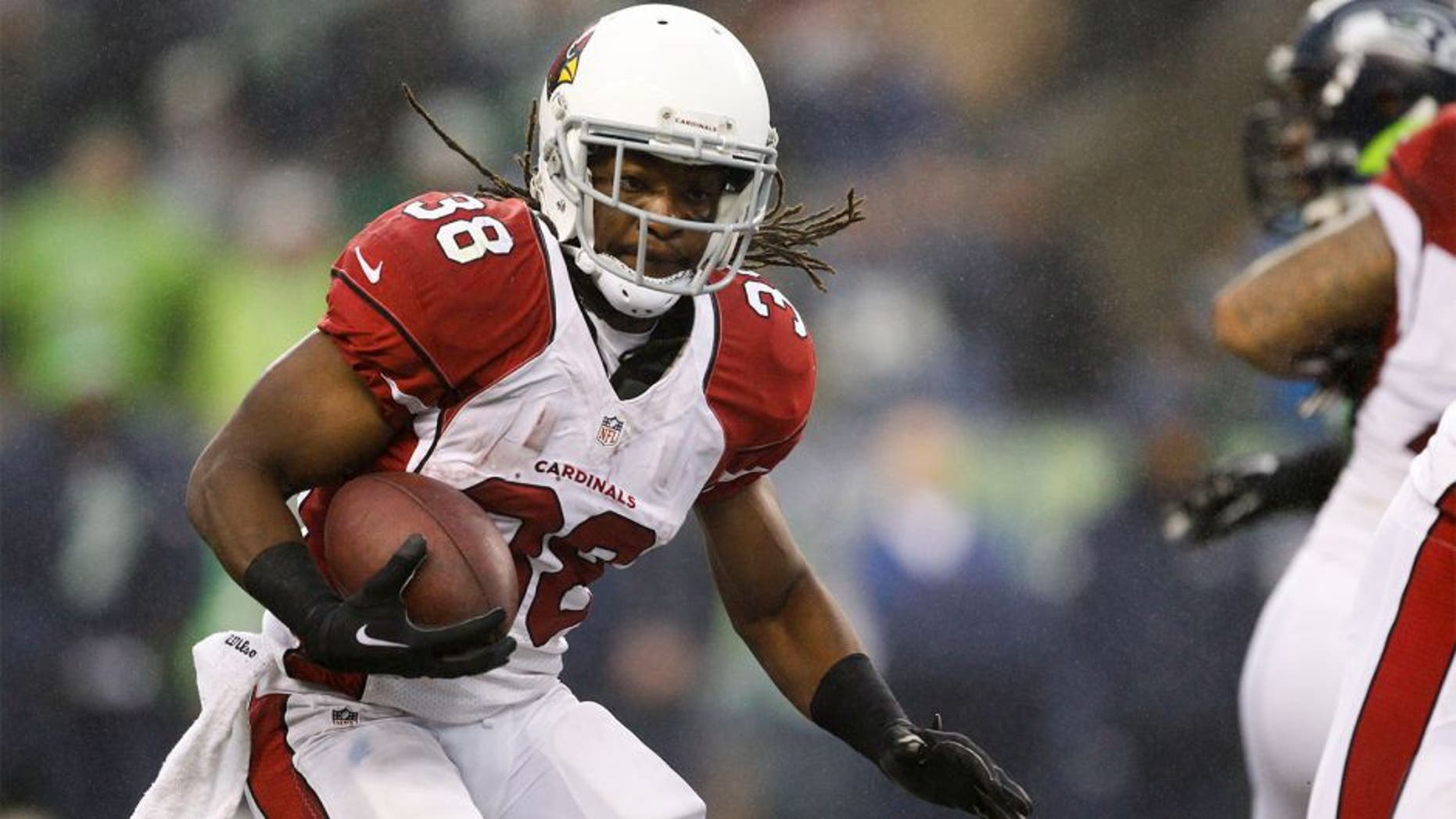 Dec 22, 2013; Seattle, WA, USA; Arizona Cardinals running back Andre Ellington (38) rushes against the Seattle Seahawks during the third quarter at CenturyLink Field. Mandatory Credit: Joe Nicholson-USA TODAY Sports