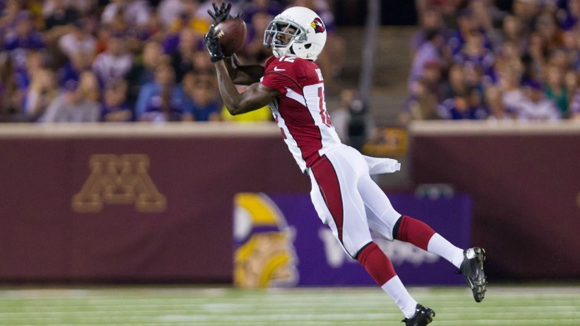 Aug 16, 2014; Minneapolis, MN, USA; Arizona Cardinals wide receiver John Brown (12) catches a pass in the second quarter against the Minnesota Vikings at TCF Bank Stadium. Mandatory Credit: Brad Rempel-USA TODAY Sports