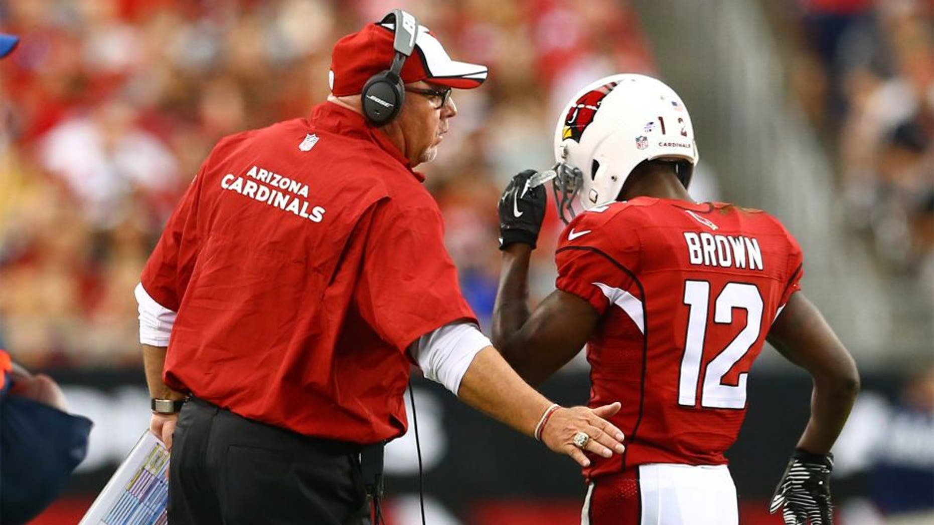 Aug 24, 2014; Glendale, AZ, USA; Arizona Cardinals wide receiver John Brown (12) with head coach Bruce Arians against the Cincinnati Bengals at University of Phoenix Stadium. Mandatory Credit: Mark J. Rebilas-USA TODAY Sports
