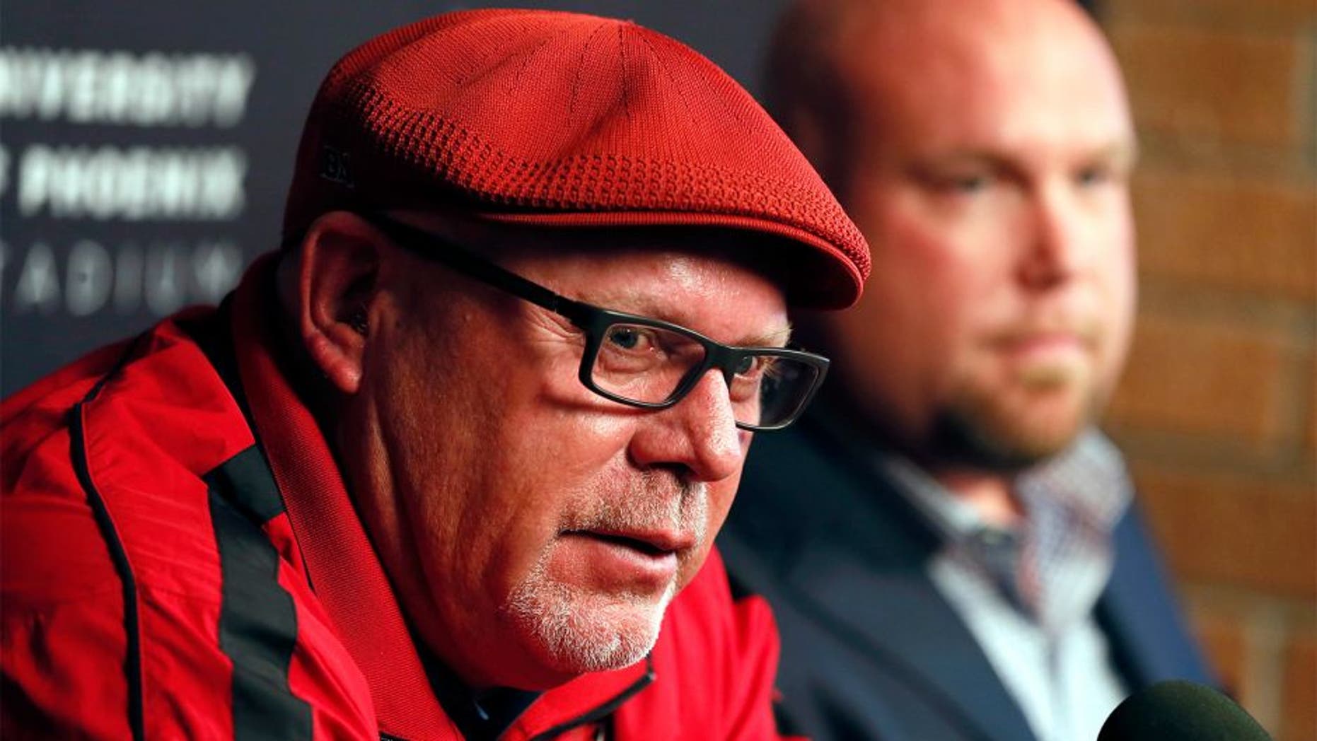 Arizona Cardinals head coach Bruce Arians, left, and general manager Steve Keim speak during a news conference Tuesday, Feb. 24, 2015, in Tempe, Ariz. Both Keim and Arians were given contract extensions after their successful 2014 season. (AP Photo/Matt York)